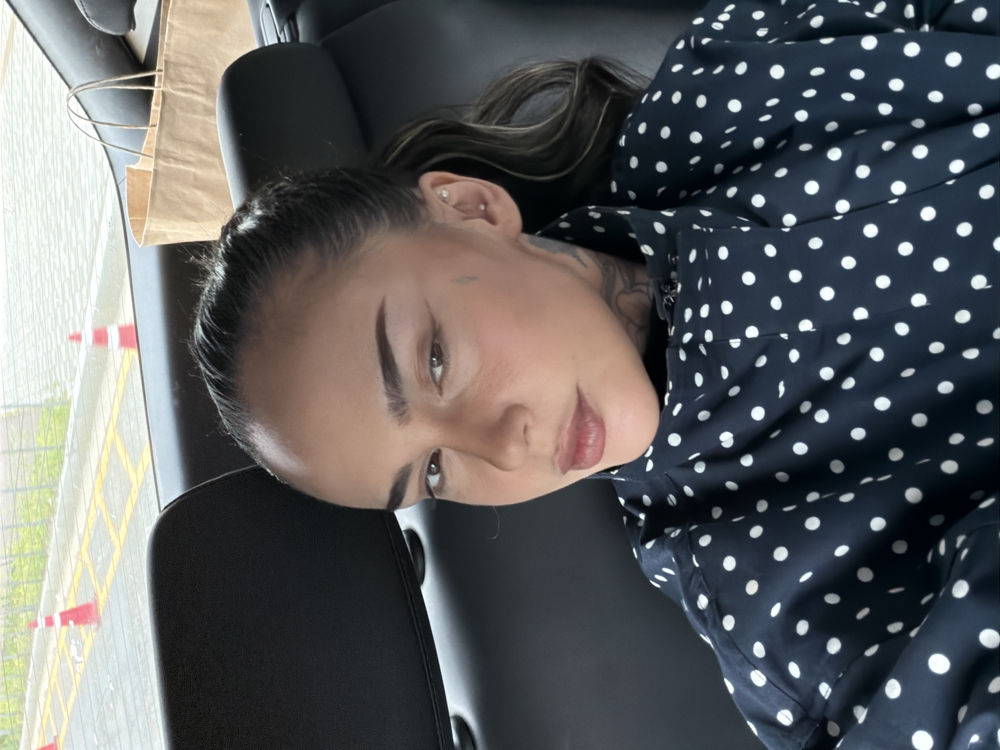 Woman in polka-dot shirt observed in vehicle, Seoul