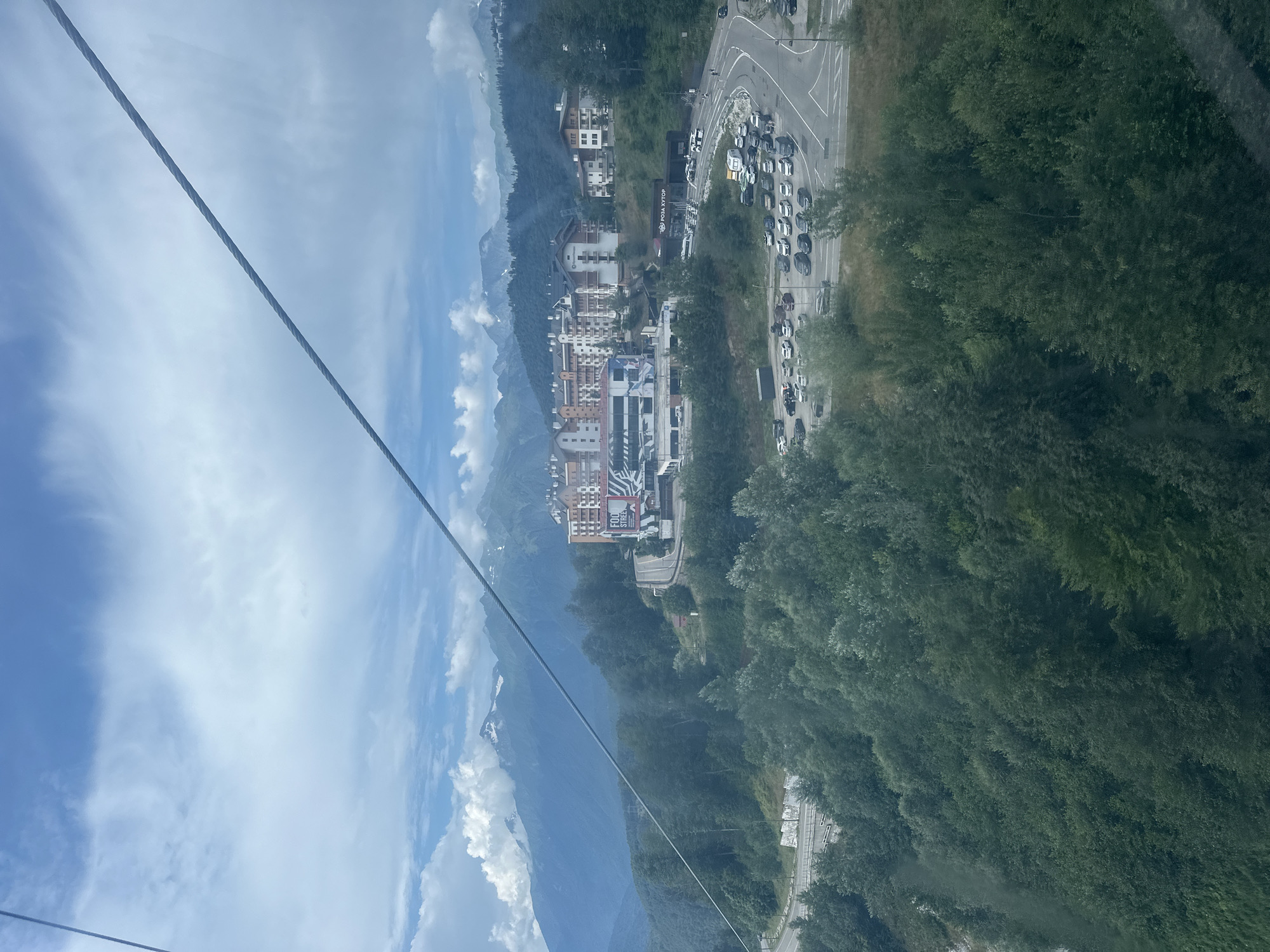 Summer views of Rosa Khutor's gondolas and green mountain slopes