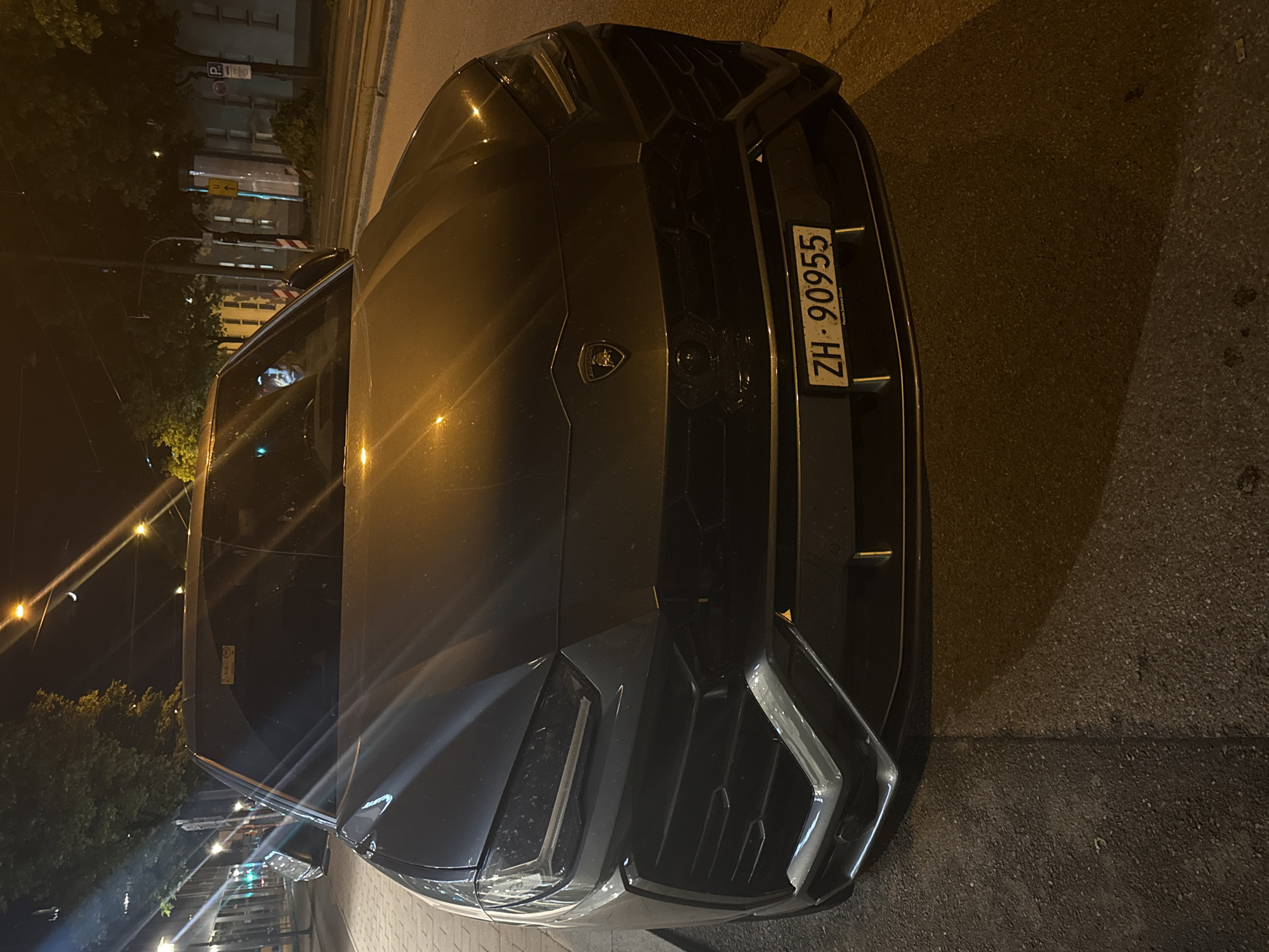 Gray Lamborghini Urus spotted parked on street at night