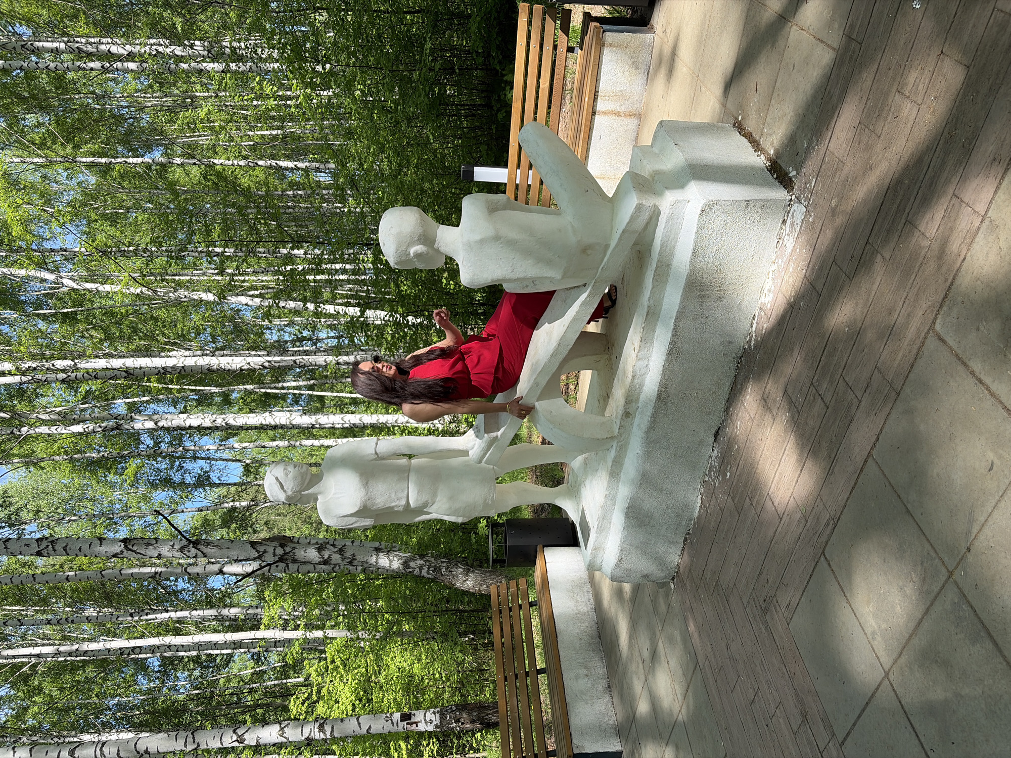 Woman in red spotted across outdoor locations during morning