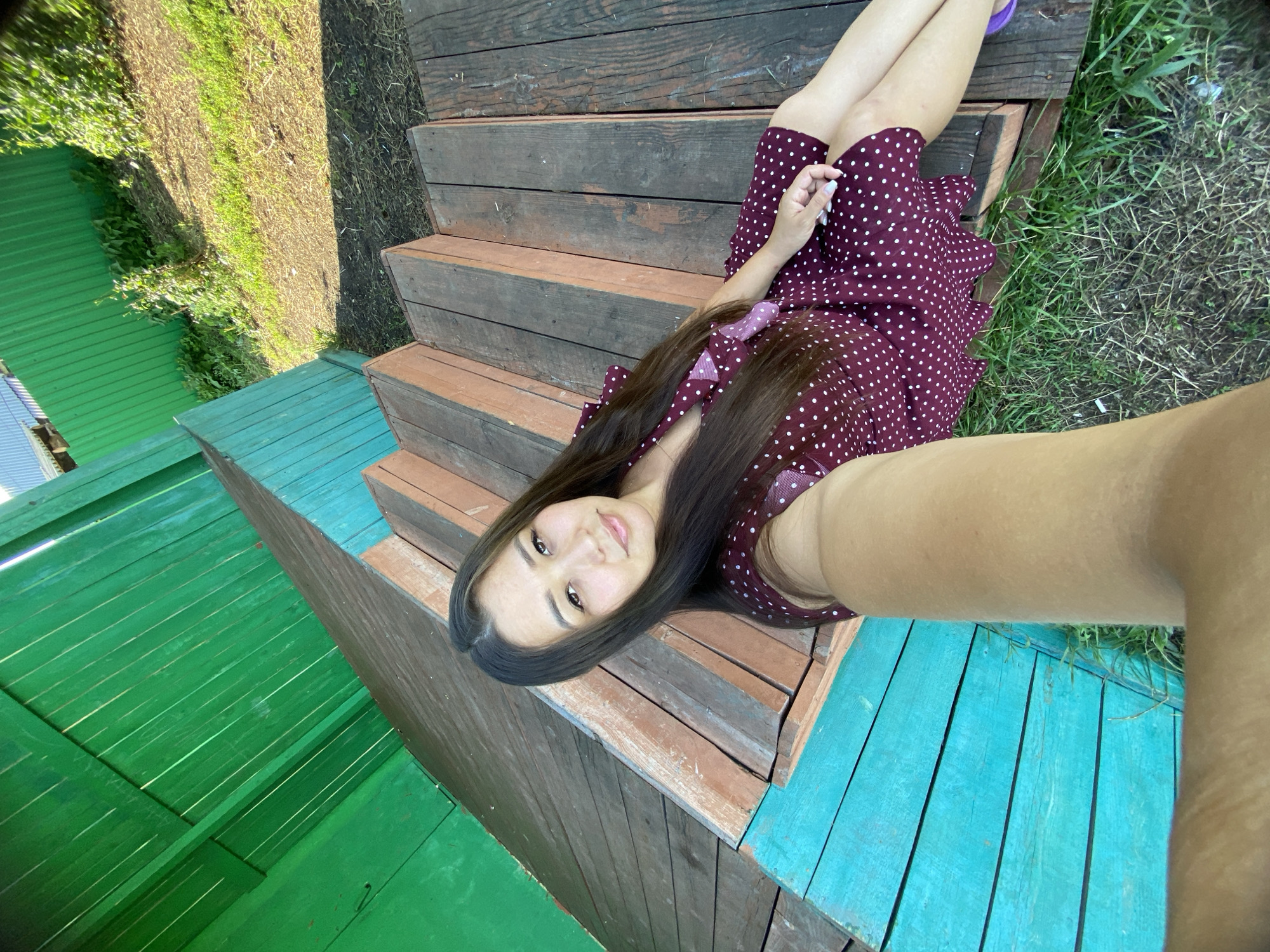 Selfie session on painted wooden steps in rural Russia