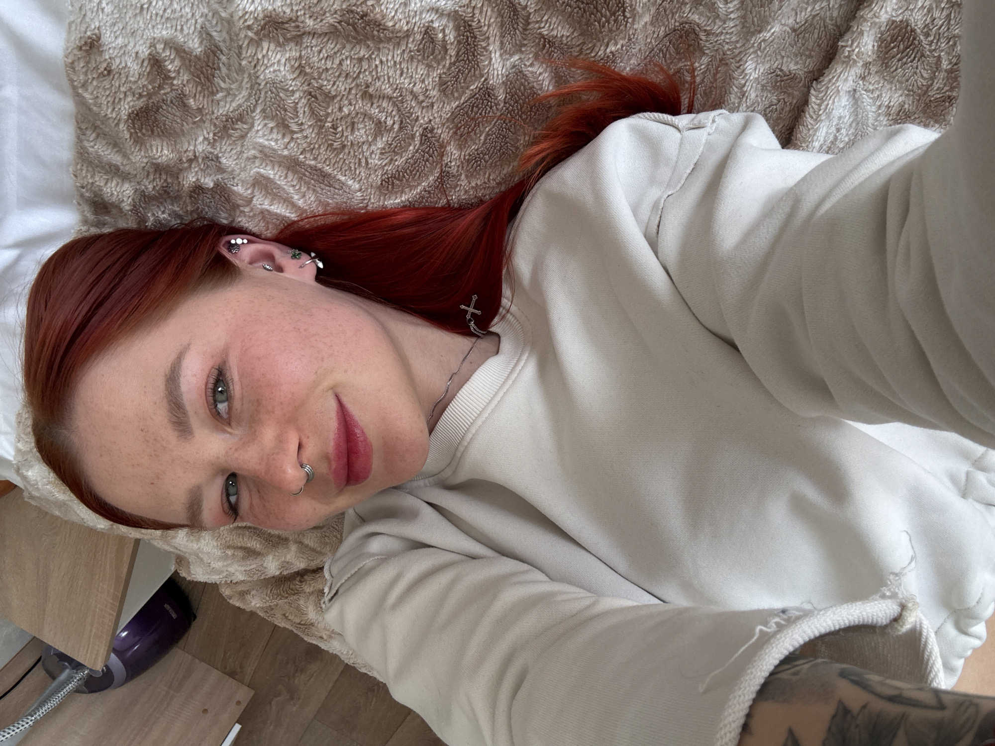 Red-haired woman photographed in casual indoor portraits, Rostov-on-Don
