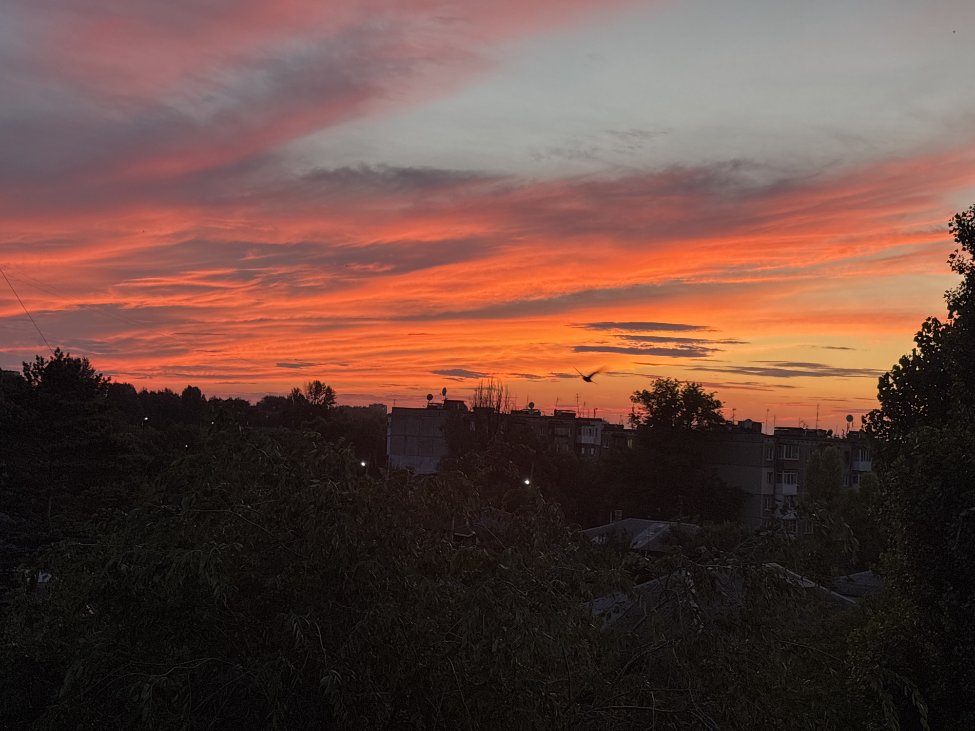 Fiery sunset lights up the sky over Kamianske, Ukraine