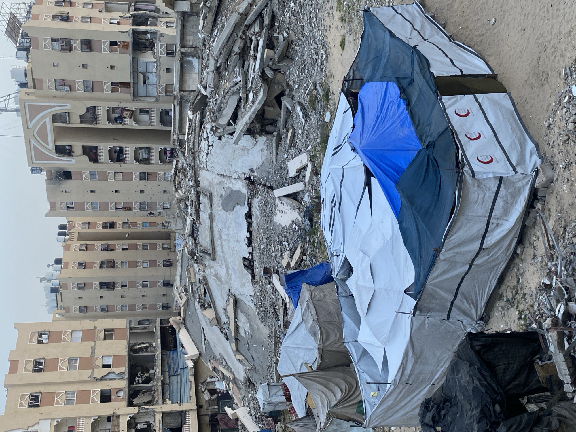 Witnesses document damaged buildings, tent camps in Khan Yunis