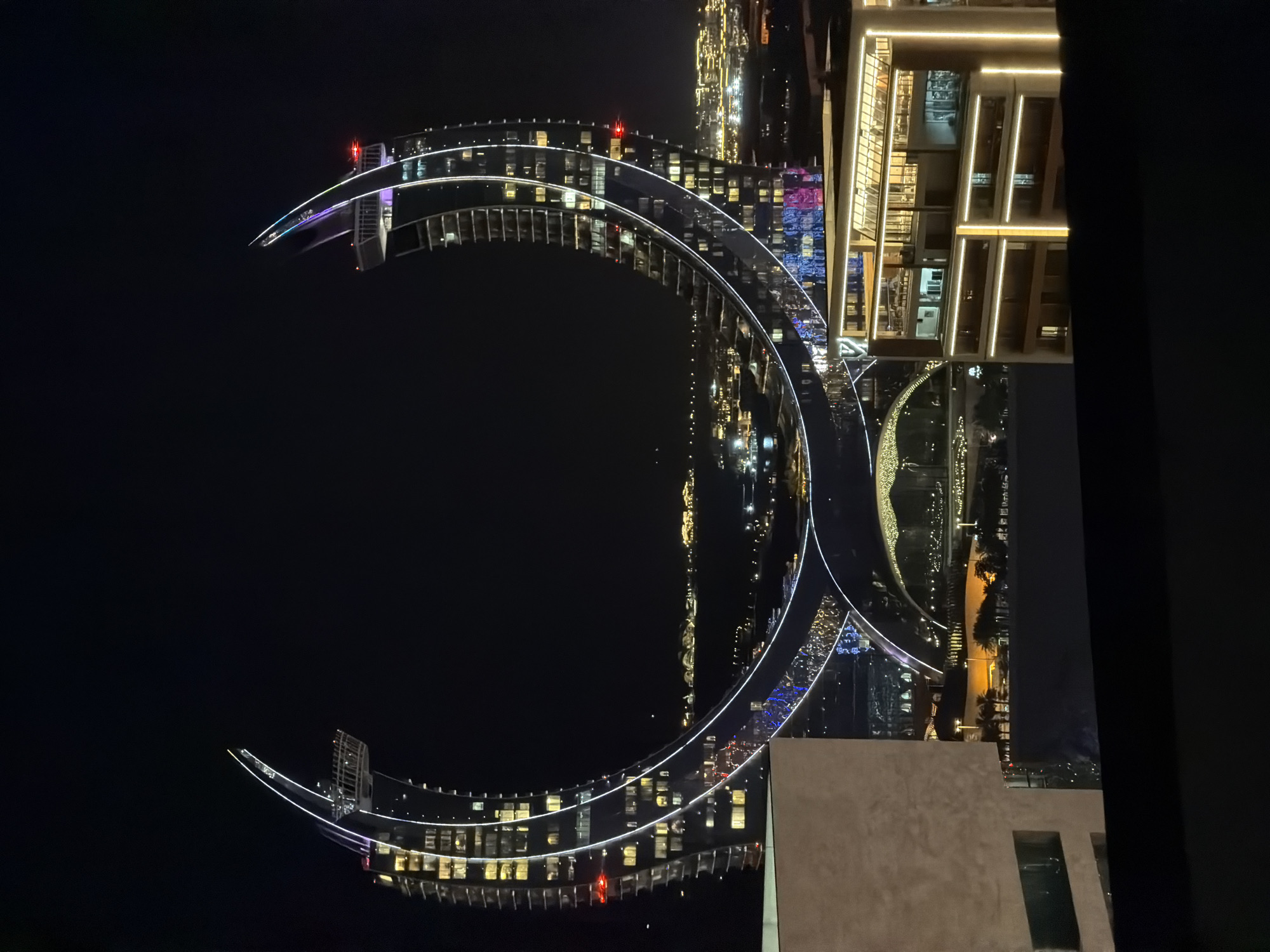 Nighttime views of illuminated Doha waterfront and Katara district
