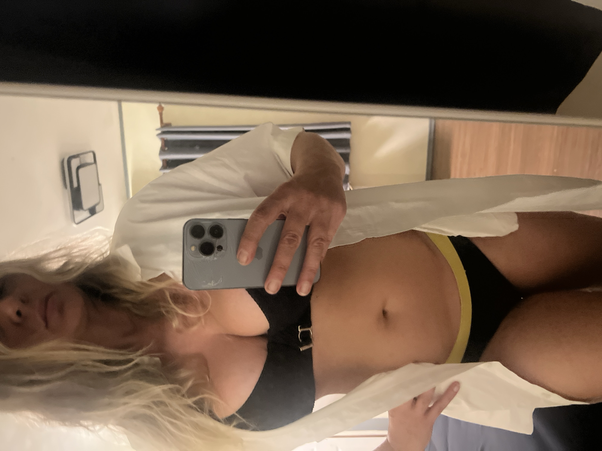 Black bikini top and open white shirt, close-up detail shots