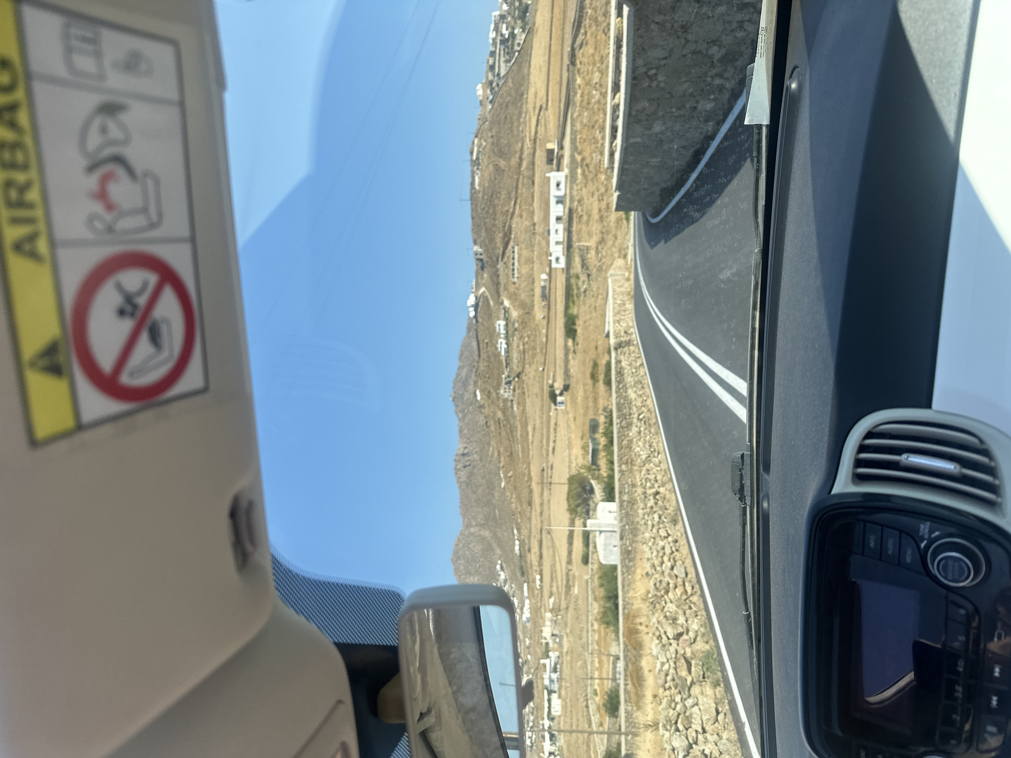 Morning drive across Mykonos ends at a turquoise Aegean beach