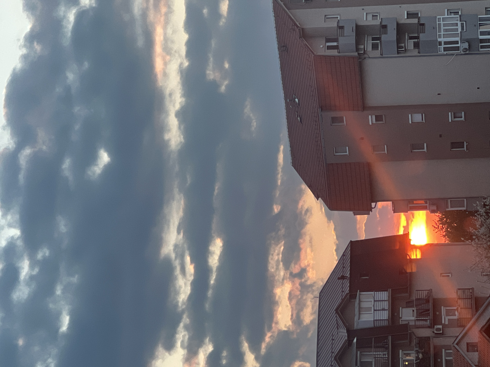 Dramatic sunset illuminates cloudy sky over Palilula, Serbia