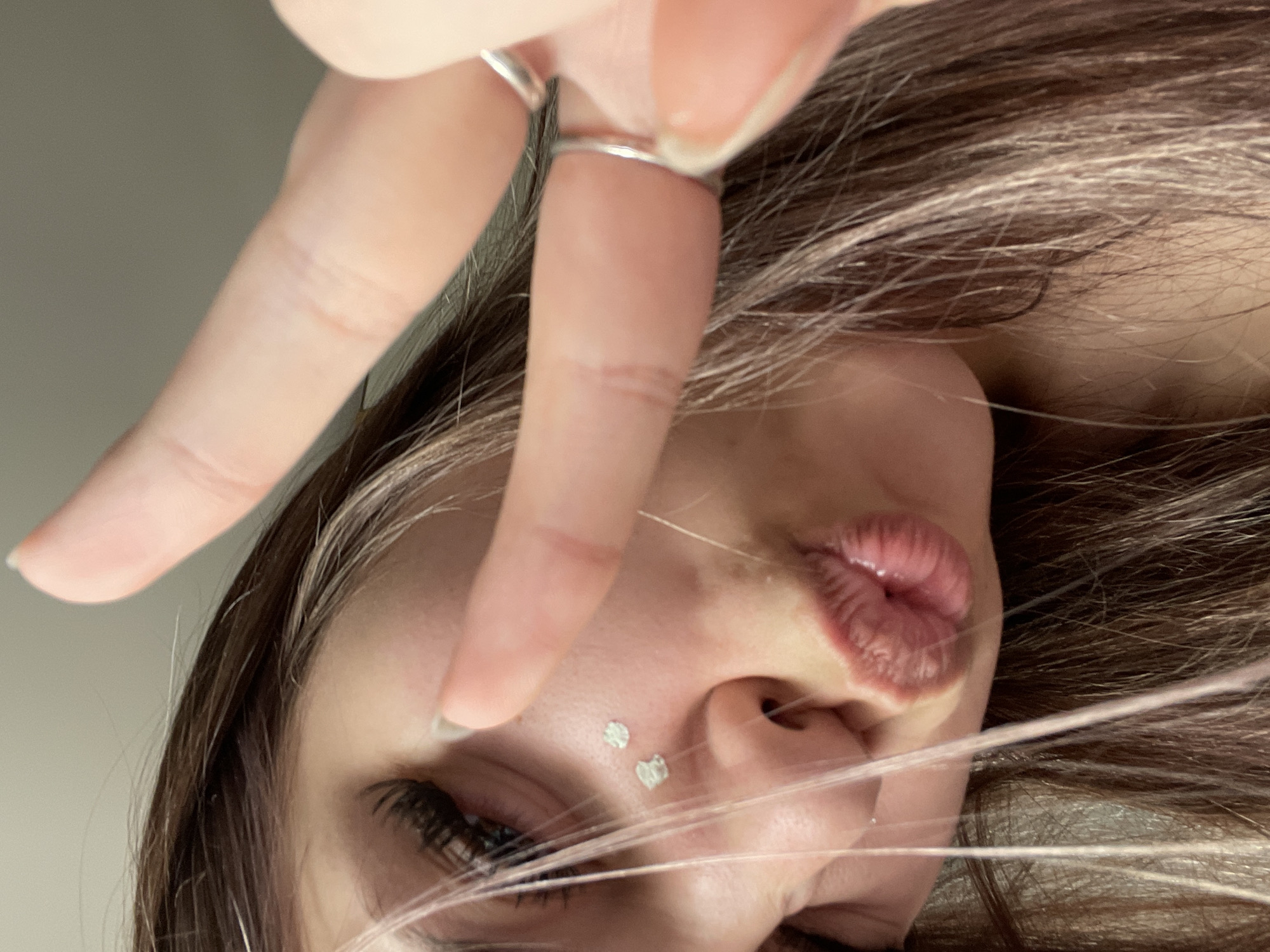 Woman photographed taking selfie, resting in Saint Petersburg bedroom