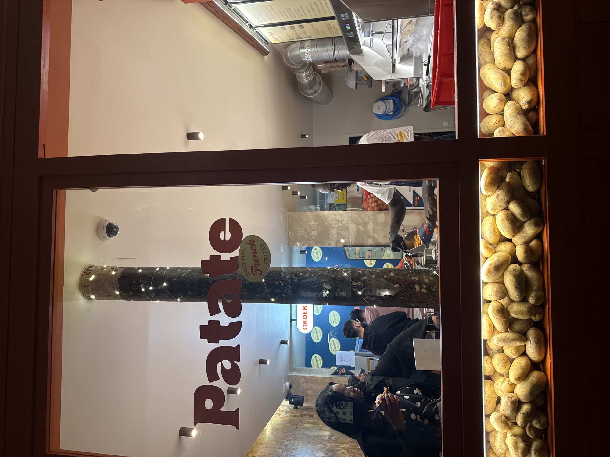 Paris French fries shop "Patate" storefront documented by witness