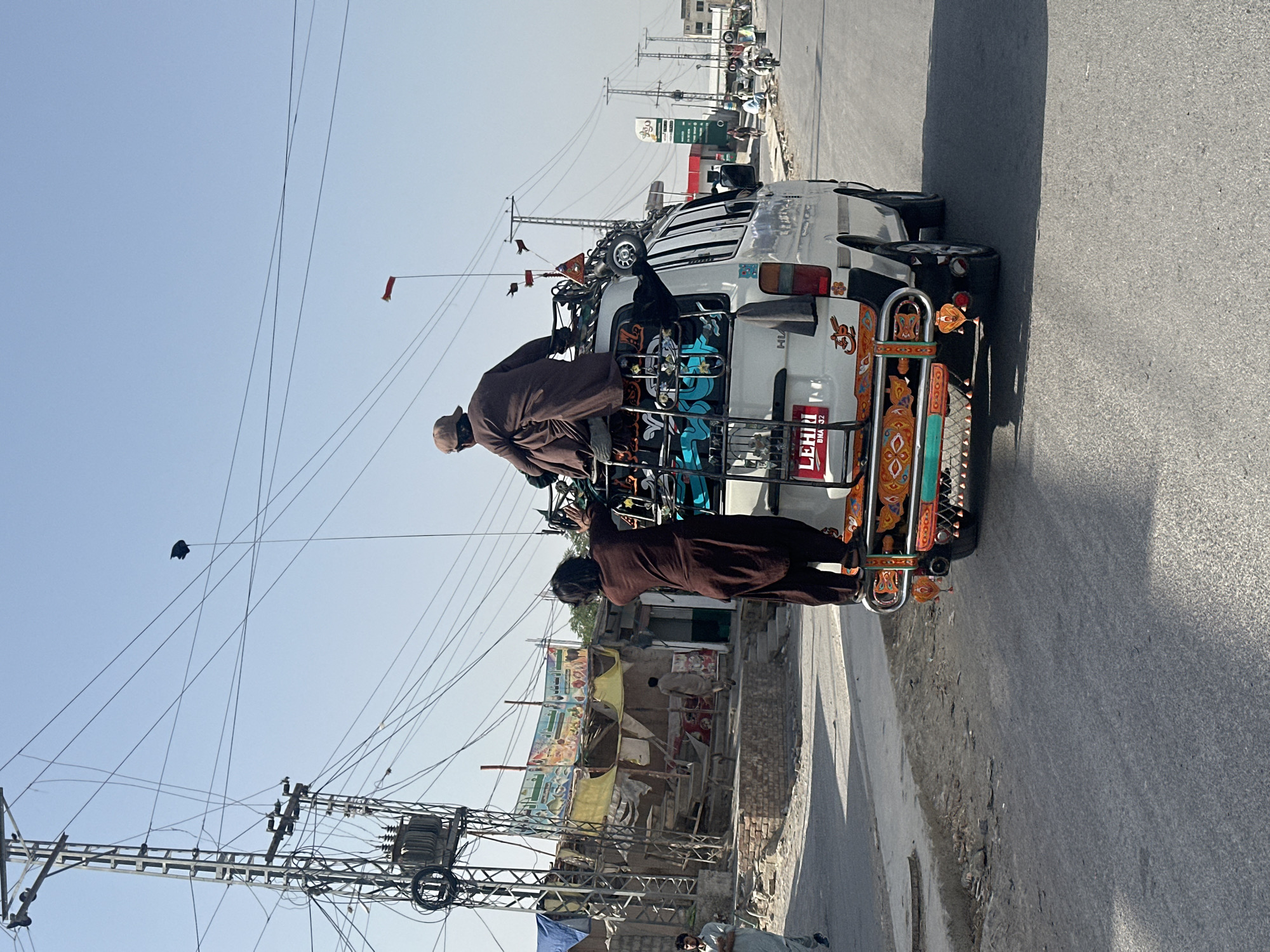 Passengers ride atop vehicles on Quetta streets early morning