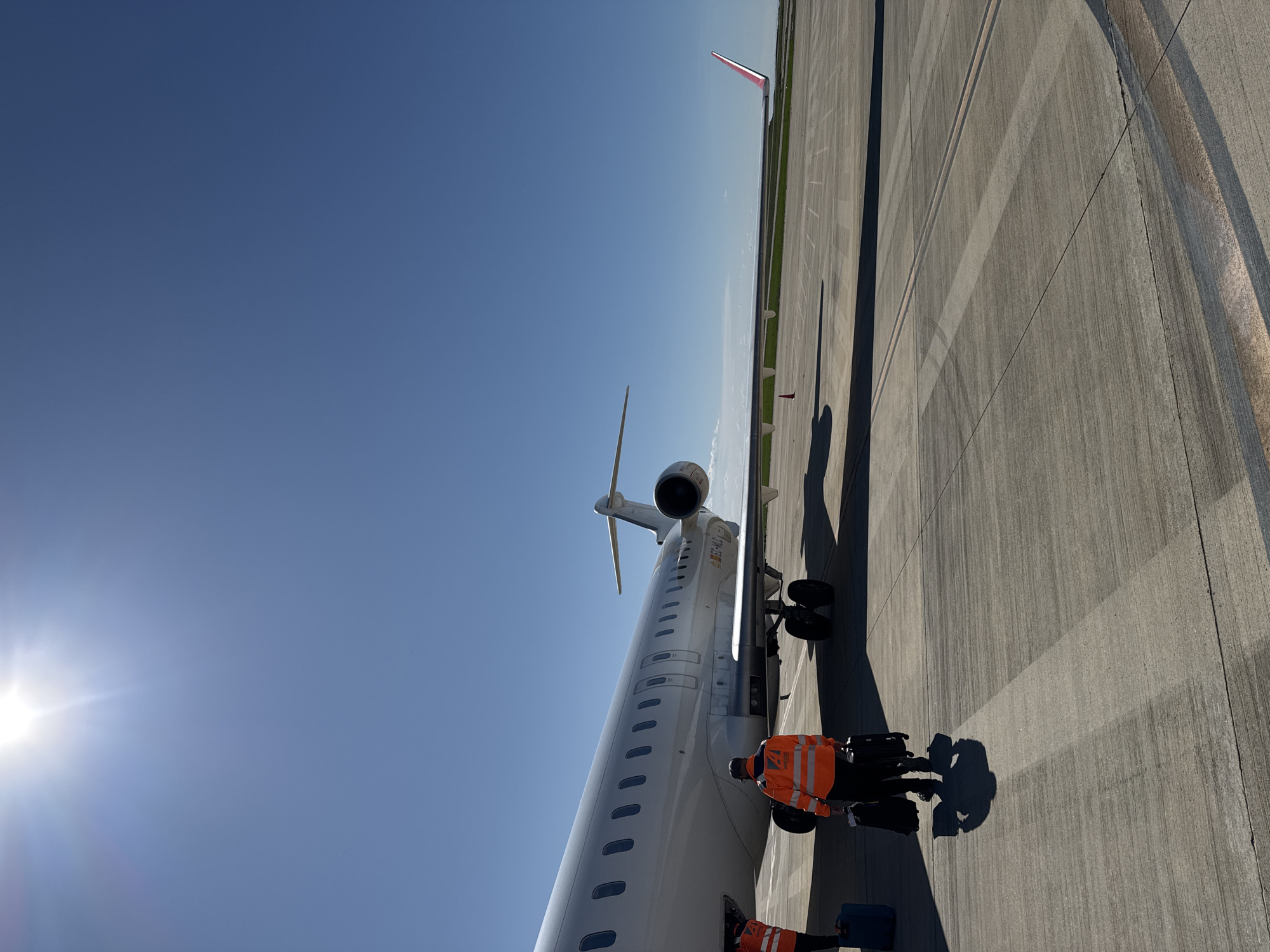 Ground crew loads passenger aircraft at Spanish regional airport
