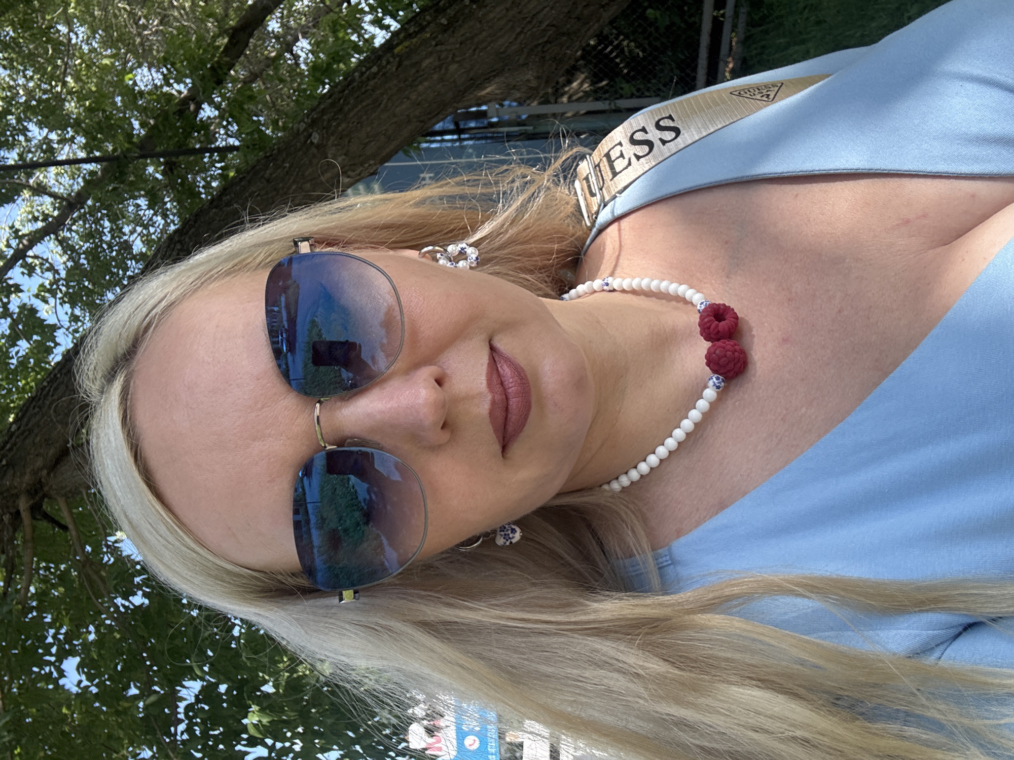 Close-up portrait with raspberry charm necklace in Komsomolsk-on-Amur