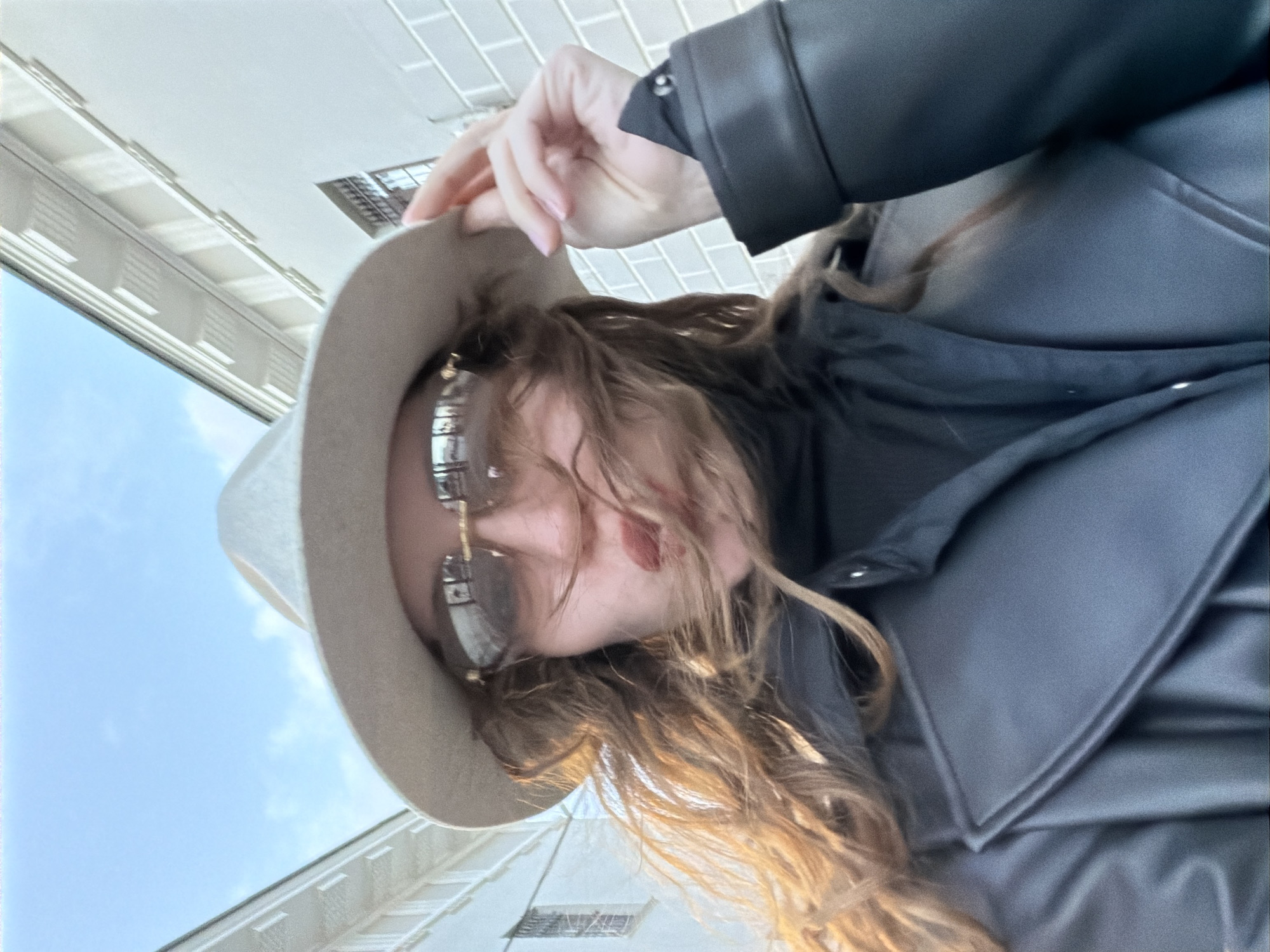 Person photographed outdoors in sunny Moscow afternoon