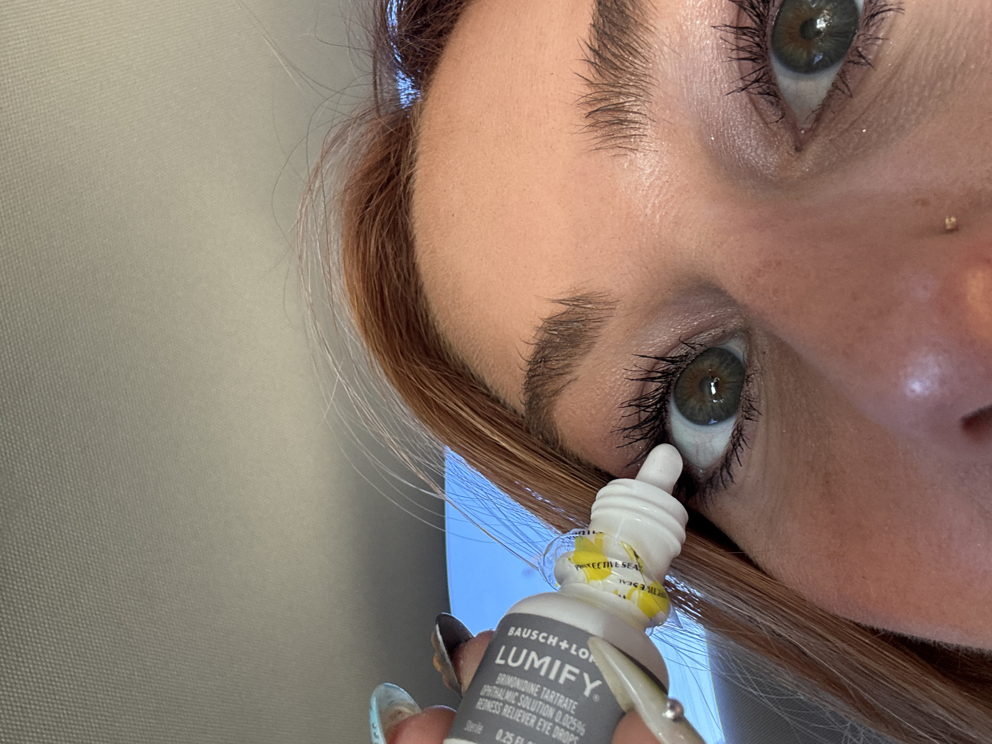 Person applies eye drops in Coachella early morning