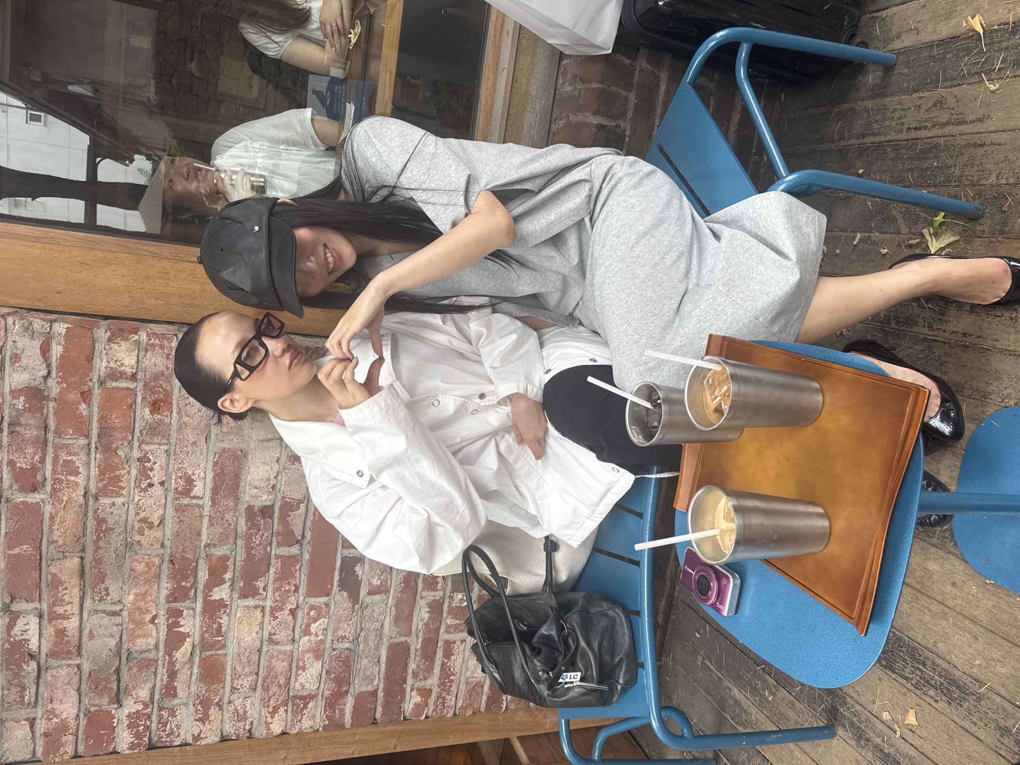 Two women share quiet moment at Seoul cafe