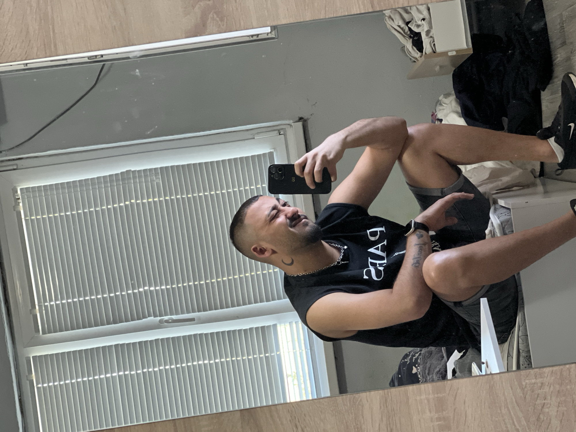 Man takes selfies indoors in Shumata, Bulgaria