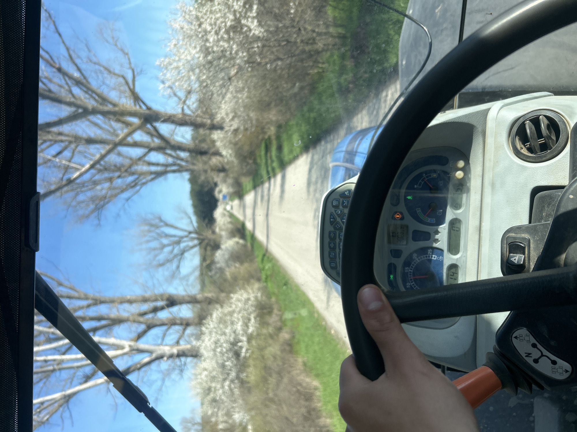 Spring drive through flowering trees in Bulgarian countryside