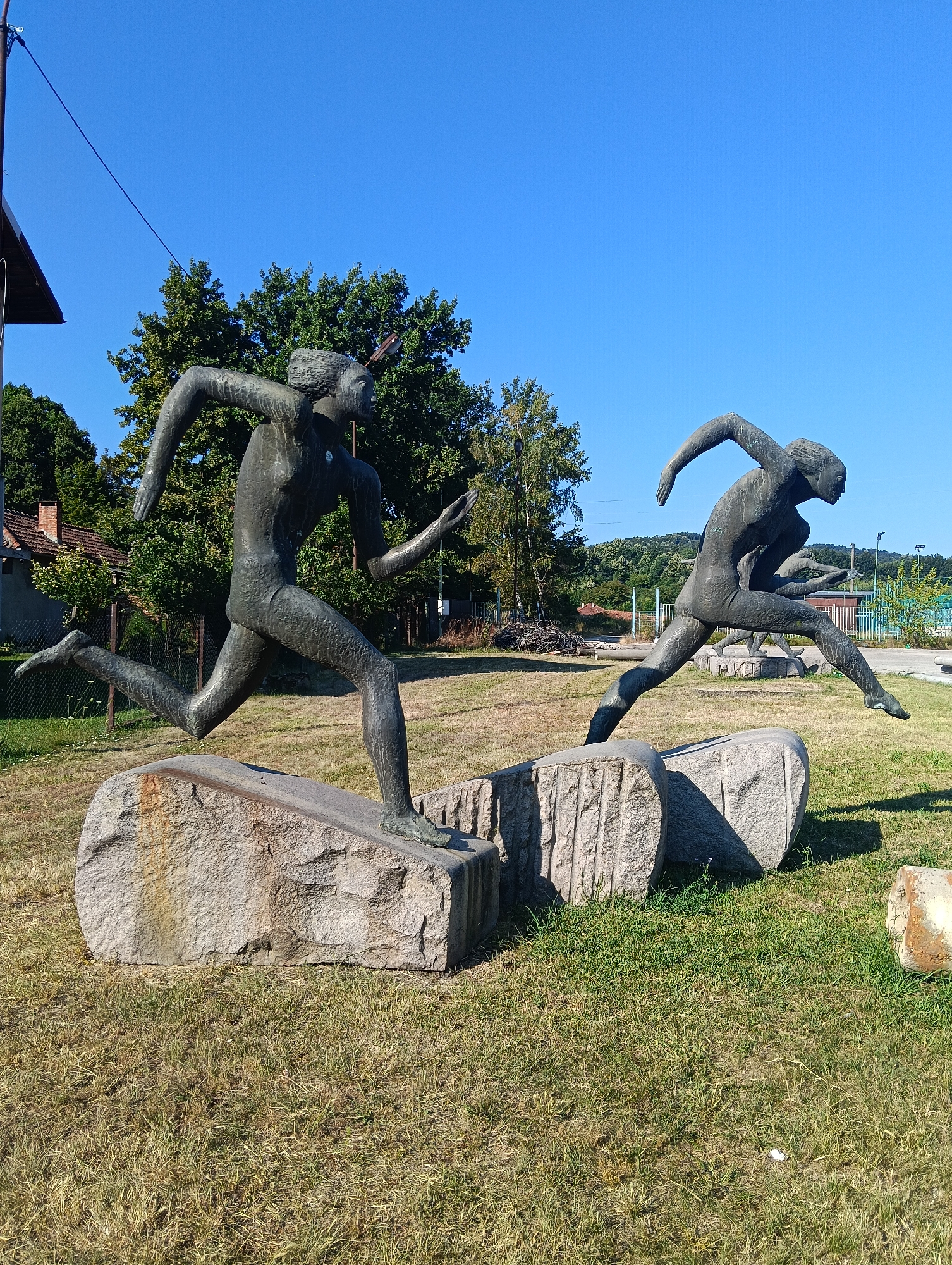 Bronze athletic sculptures on stone bases in Oreshak, Bulgaria