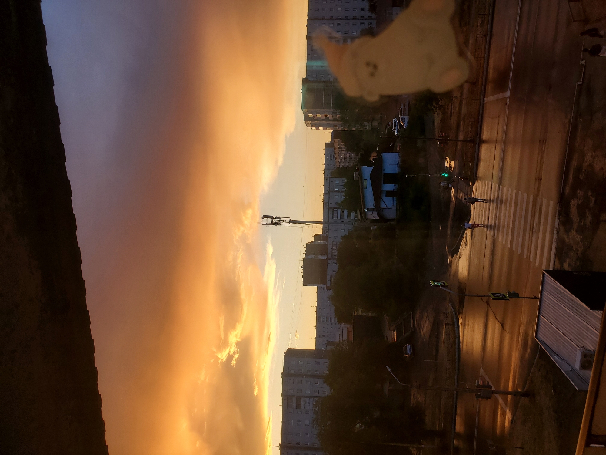 Fiery summer sunset over Sayanogorsk apartment blocks
