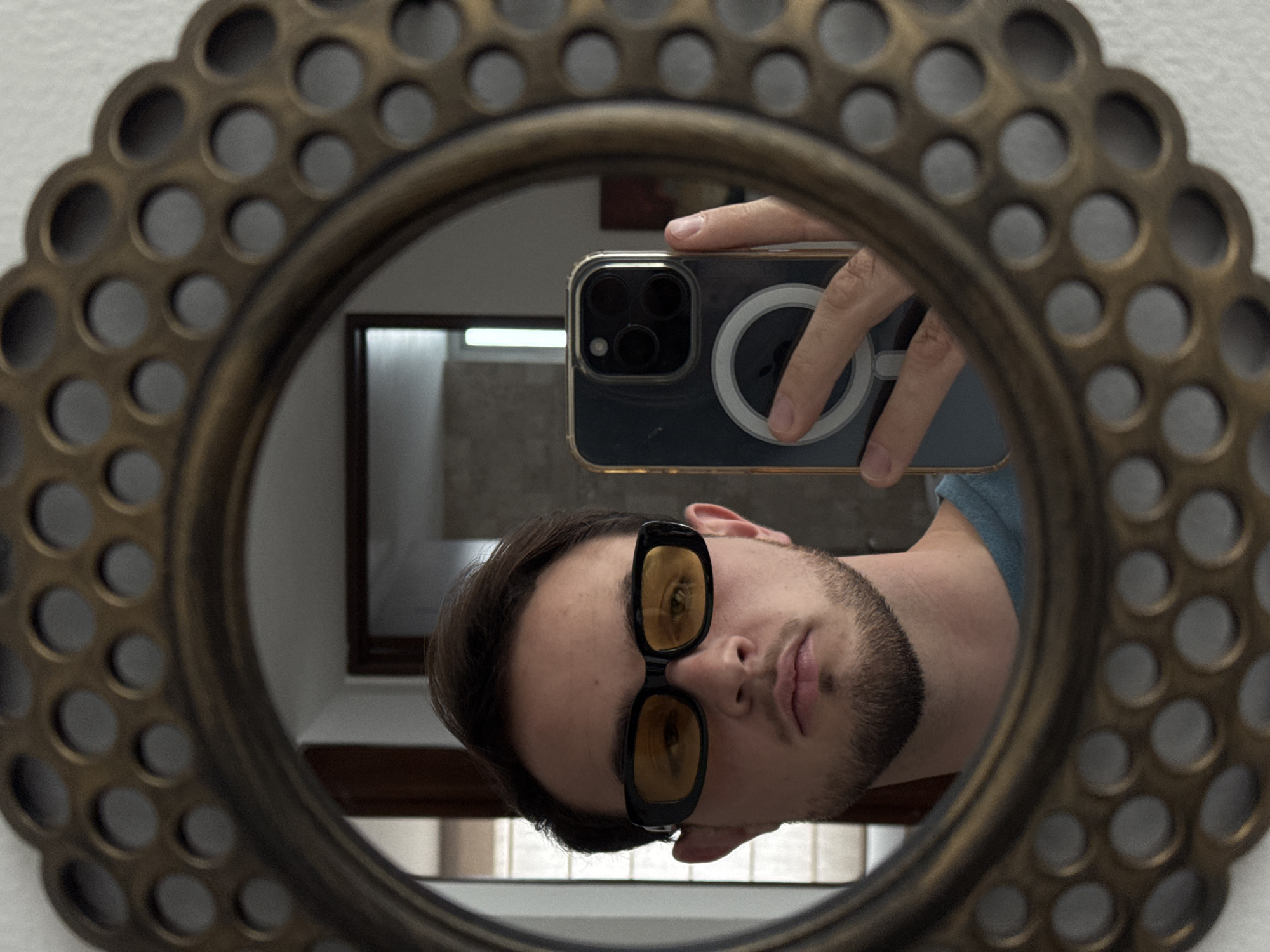 Man takes bathroom selfies in ornate mirror, Mexico
