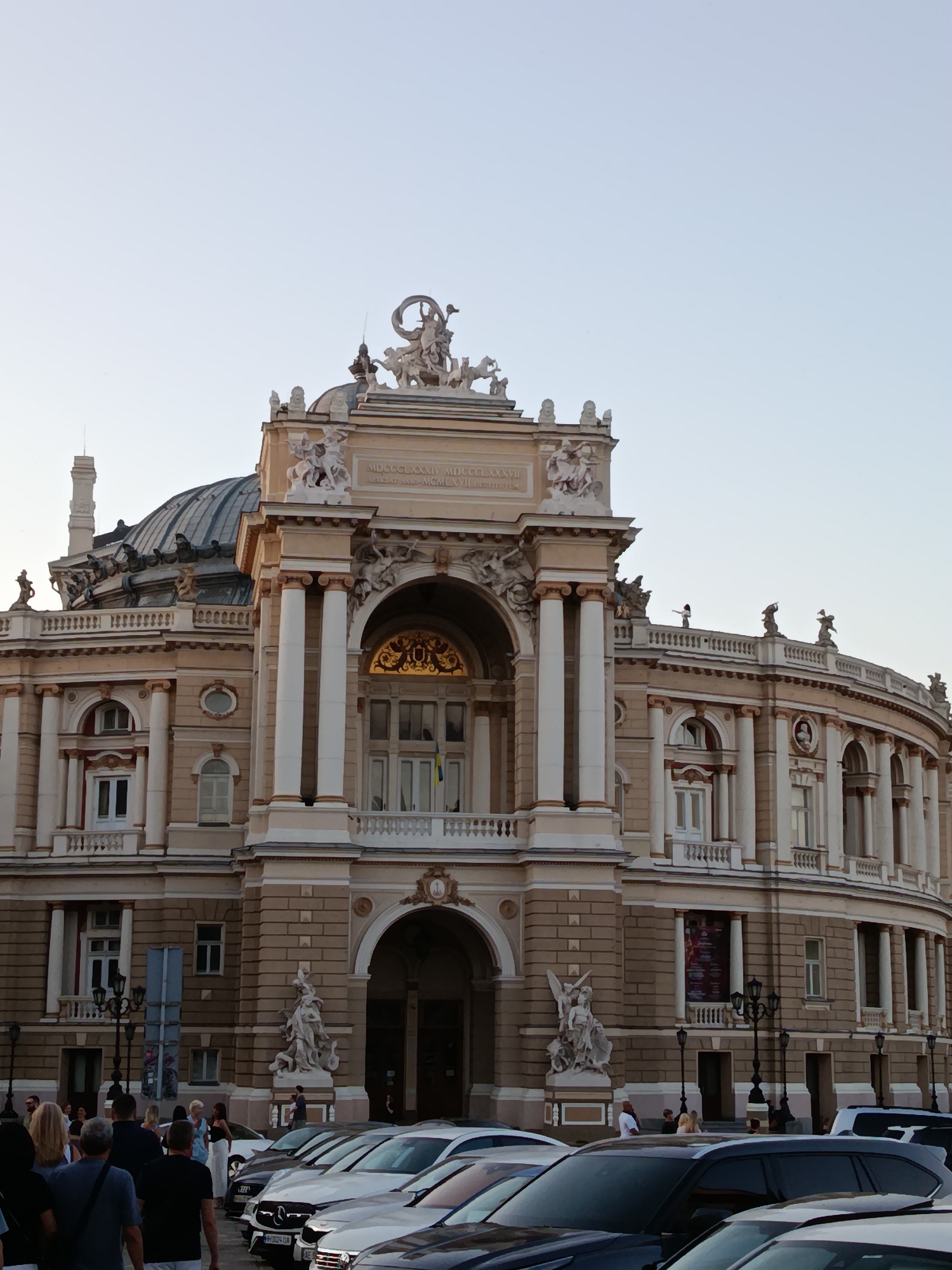 Street music, grand architecture, and gardens in a European city center