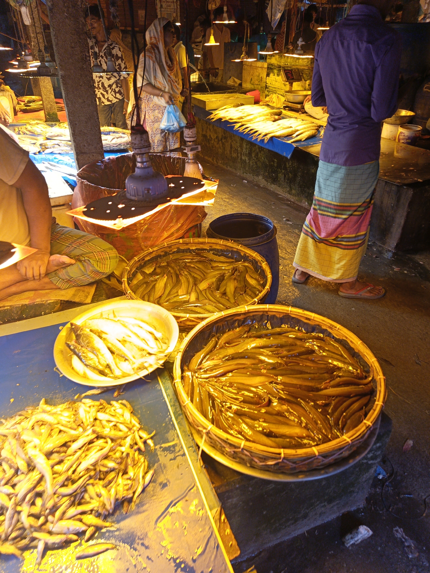 Evening market scenes documented across Dhaka, Bangladesh