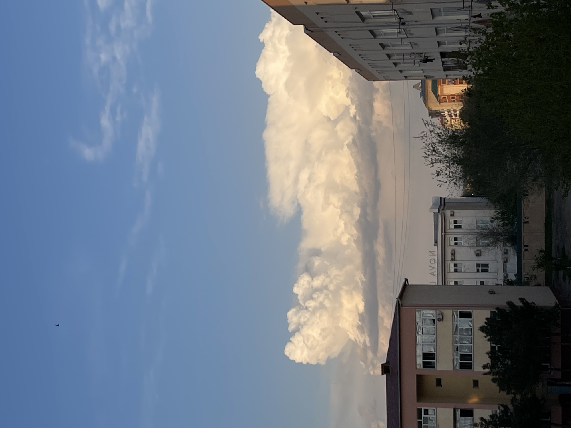 Large cumulonimbus cloud observed over Navoiy City street