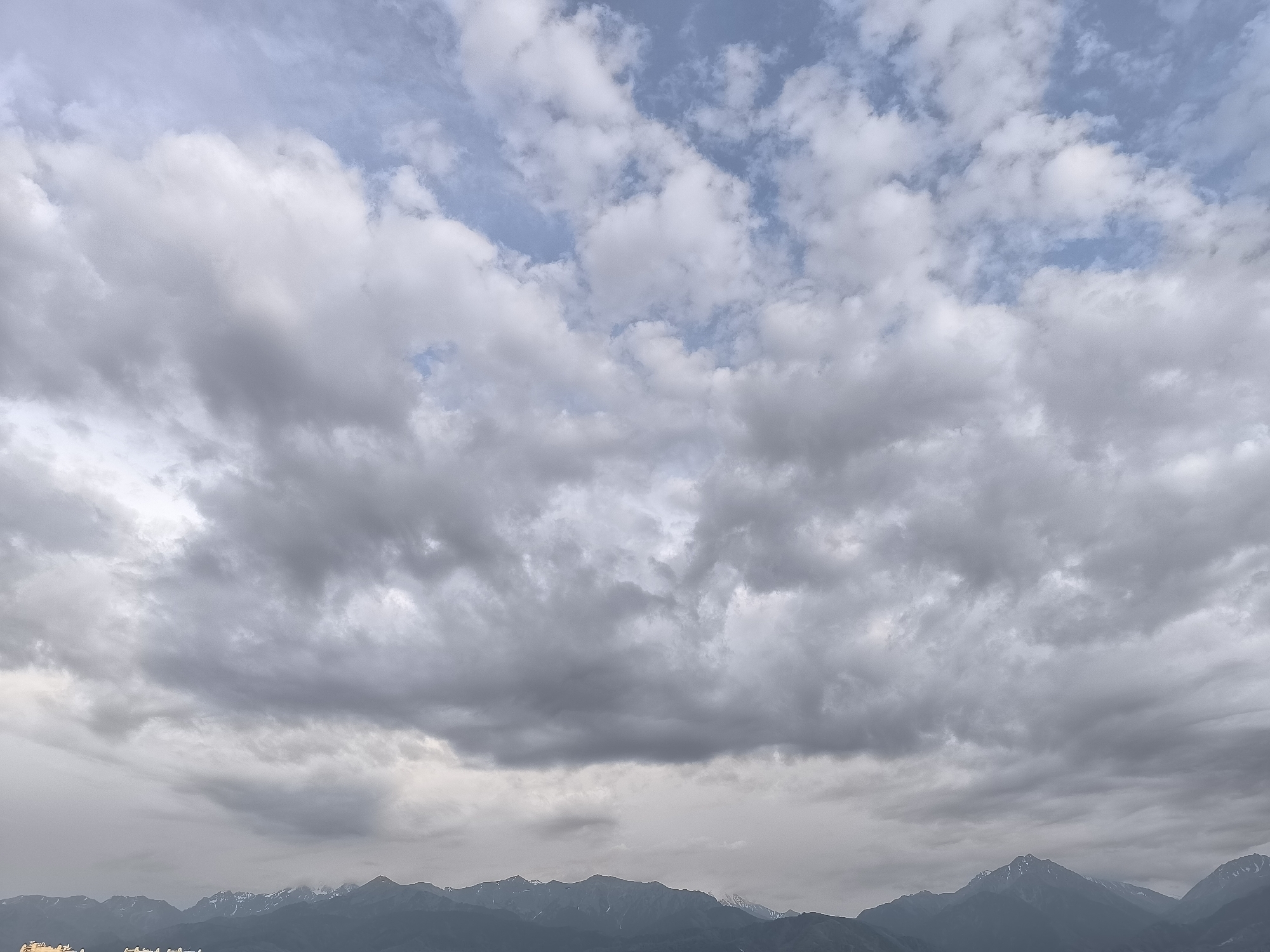Stormy skies hang over Almaty with the Alatau range in view