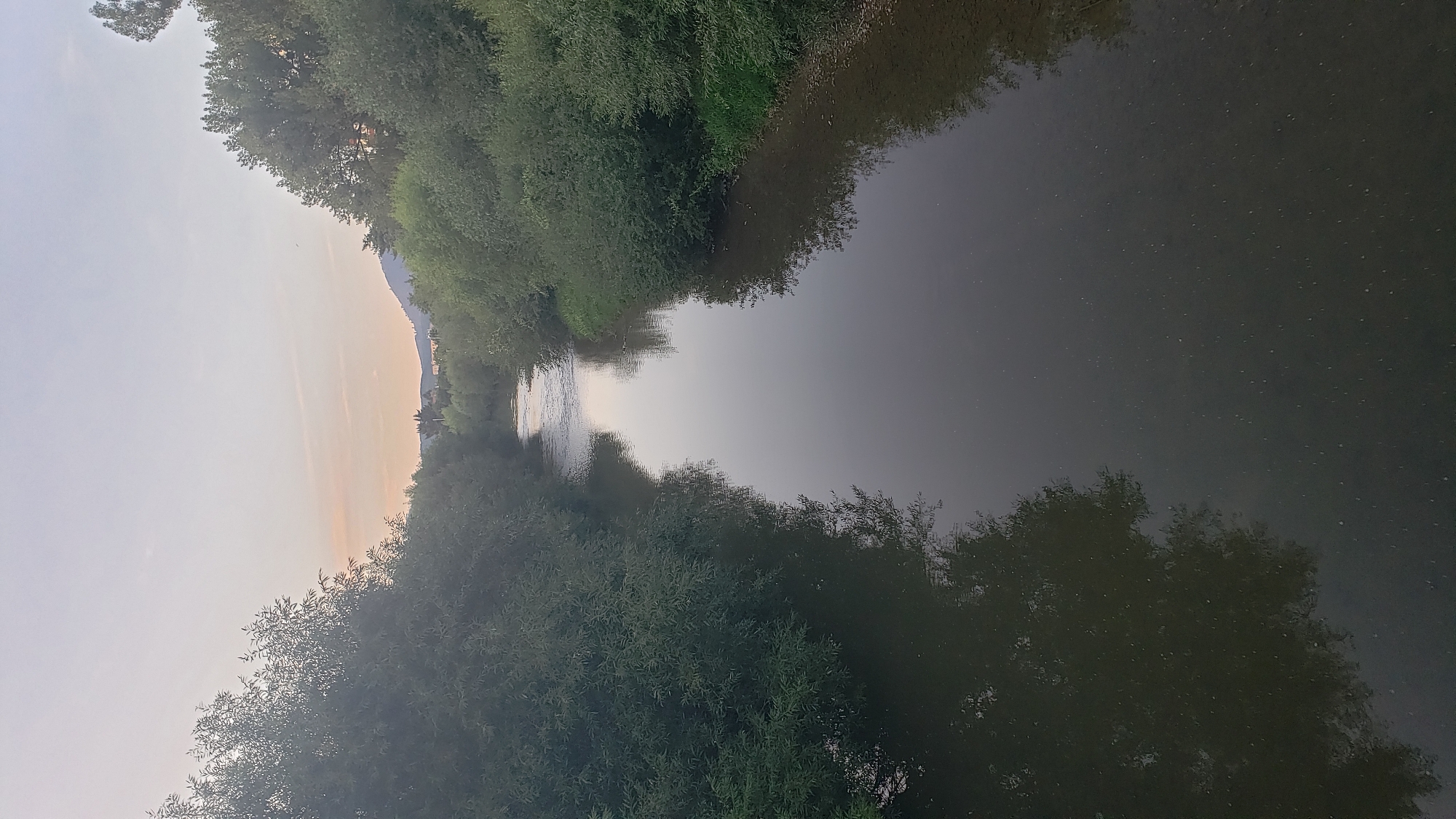 Sunset across Prešov — rivers, bridges, and city streets