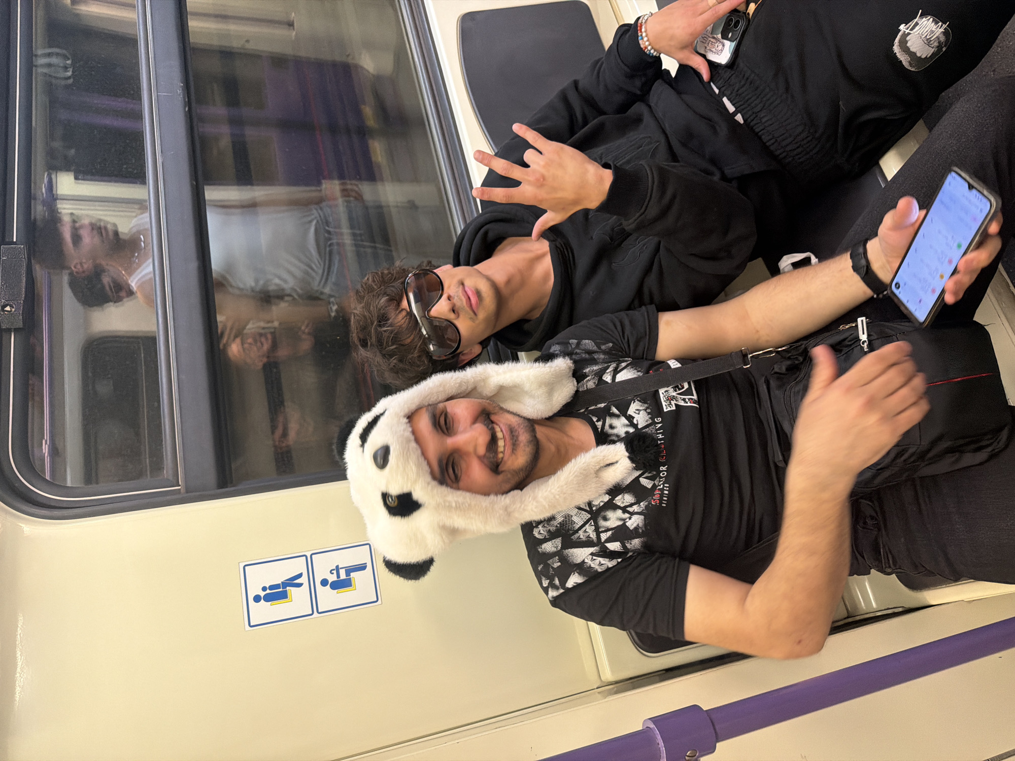 Young passengers spotted relaxing on Sofia train wearing panda hat