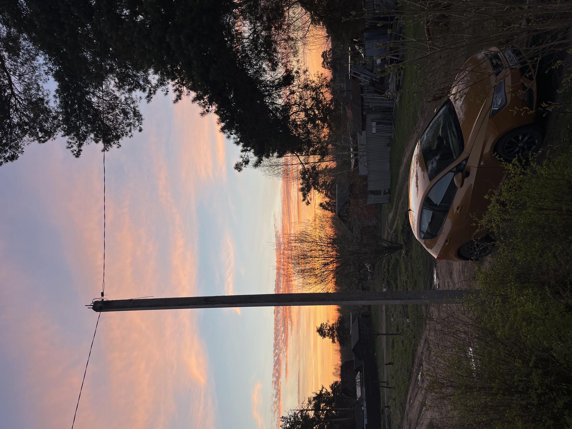 Evening home maintenance and sunset captured in Russian village