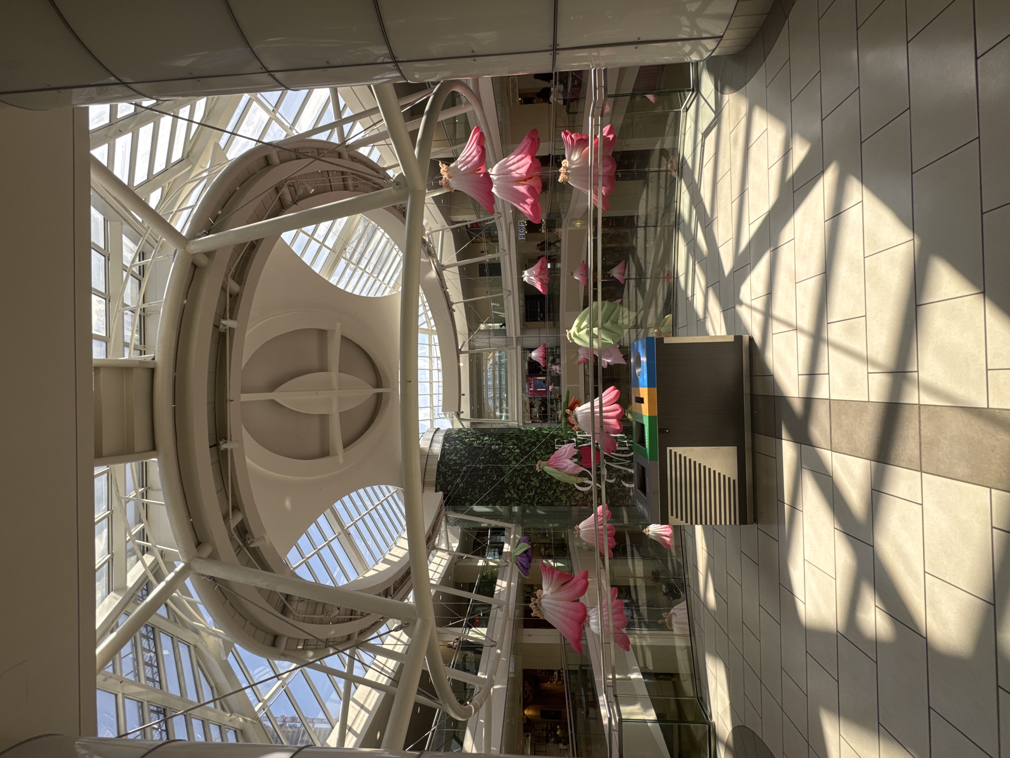 Shopper documents floral display at Burnaby mall atrium