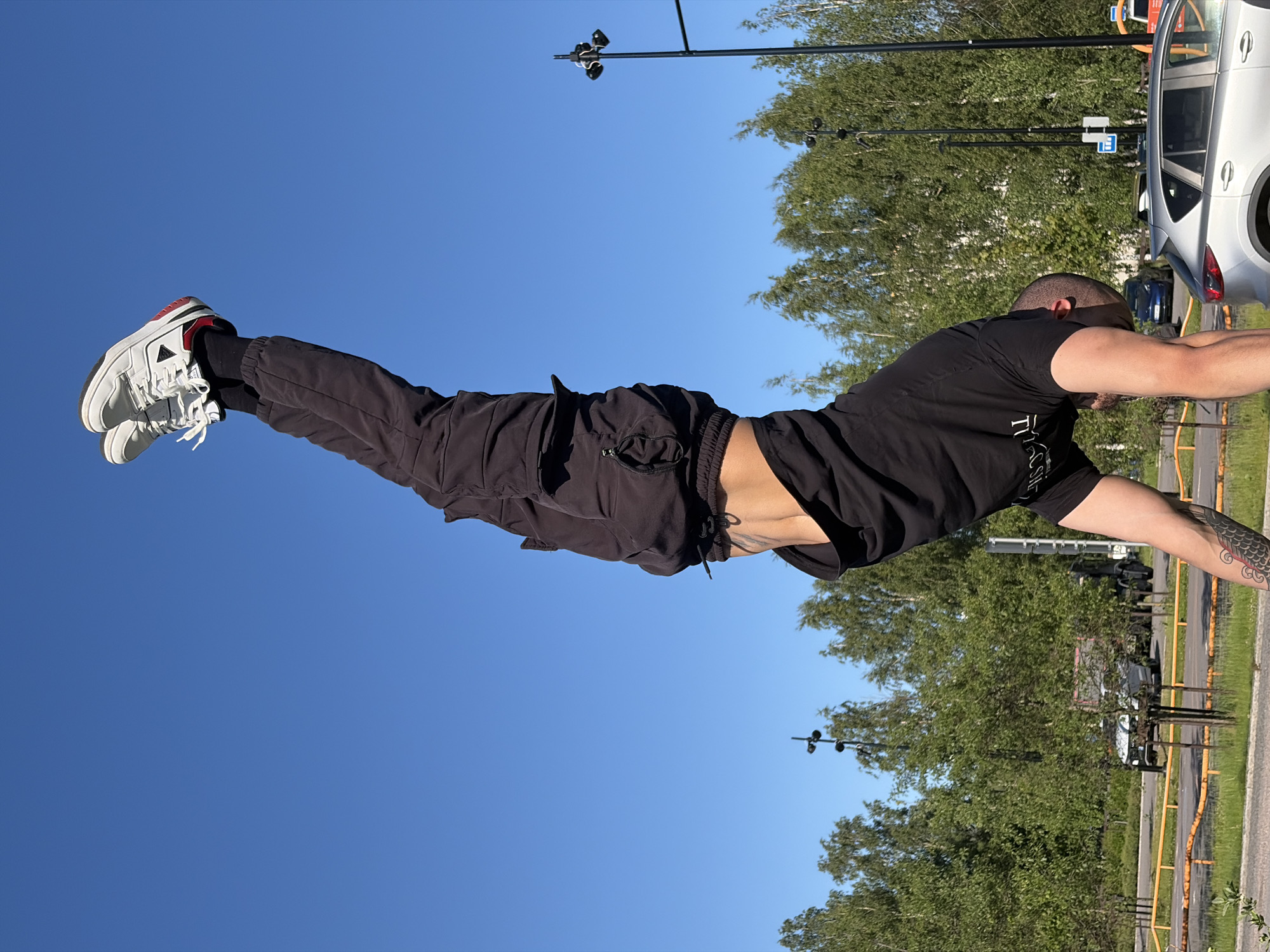 Individual practices handstands at Vantaa sports parks during sunny afternoon