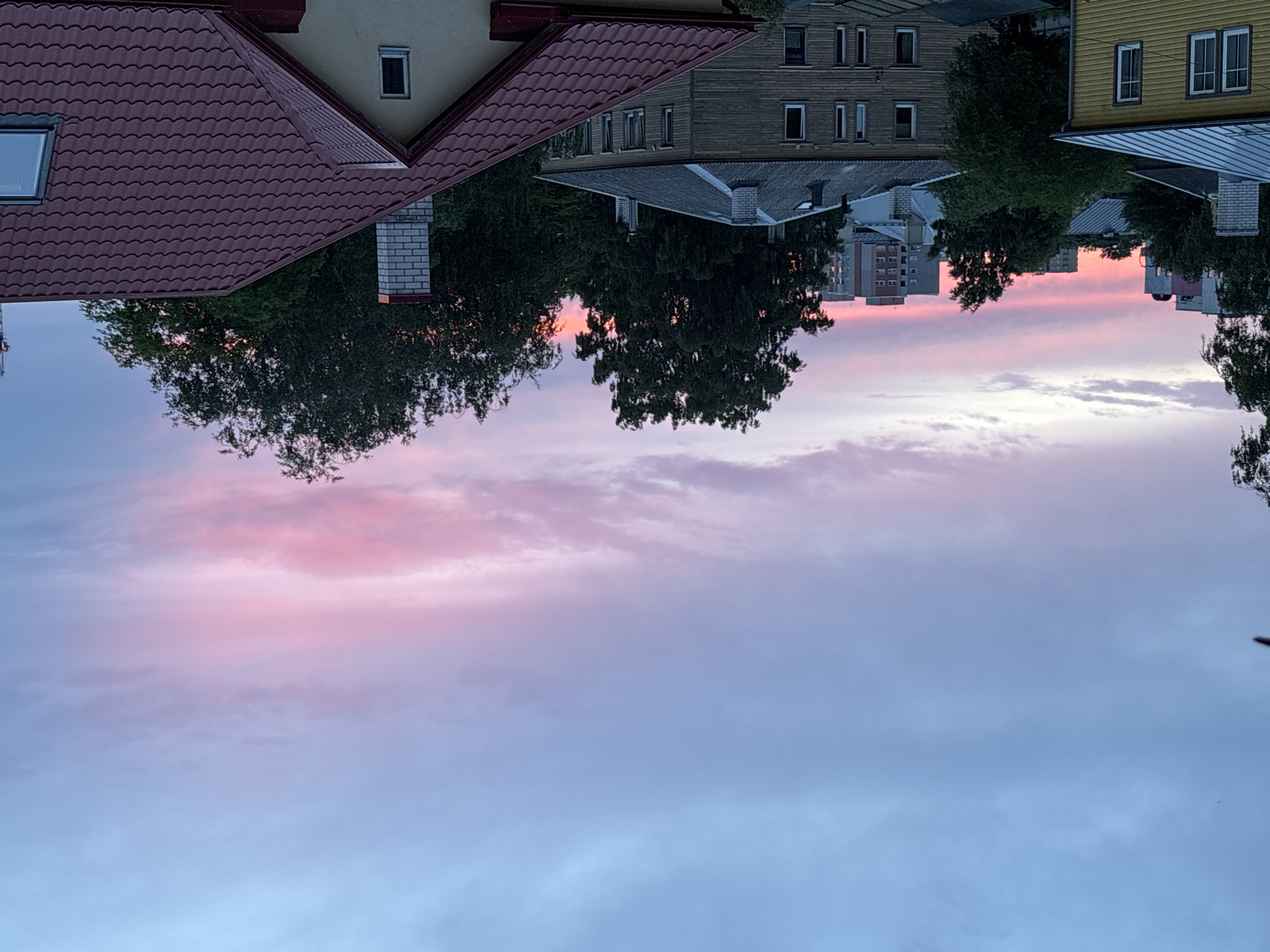 Tallinn sunset paints the sky above rooftops