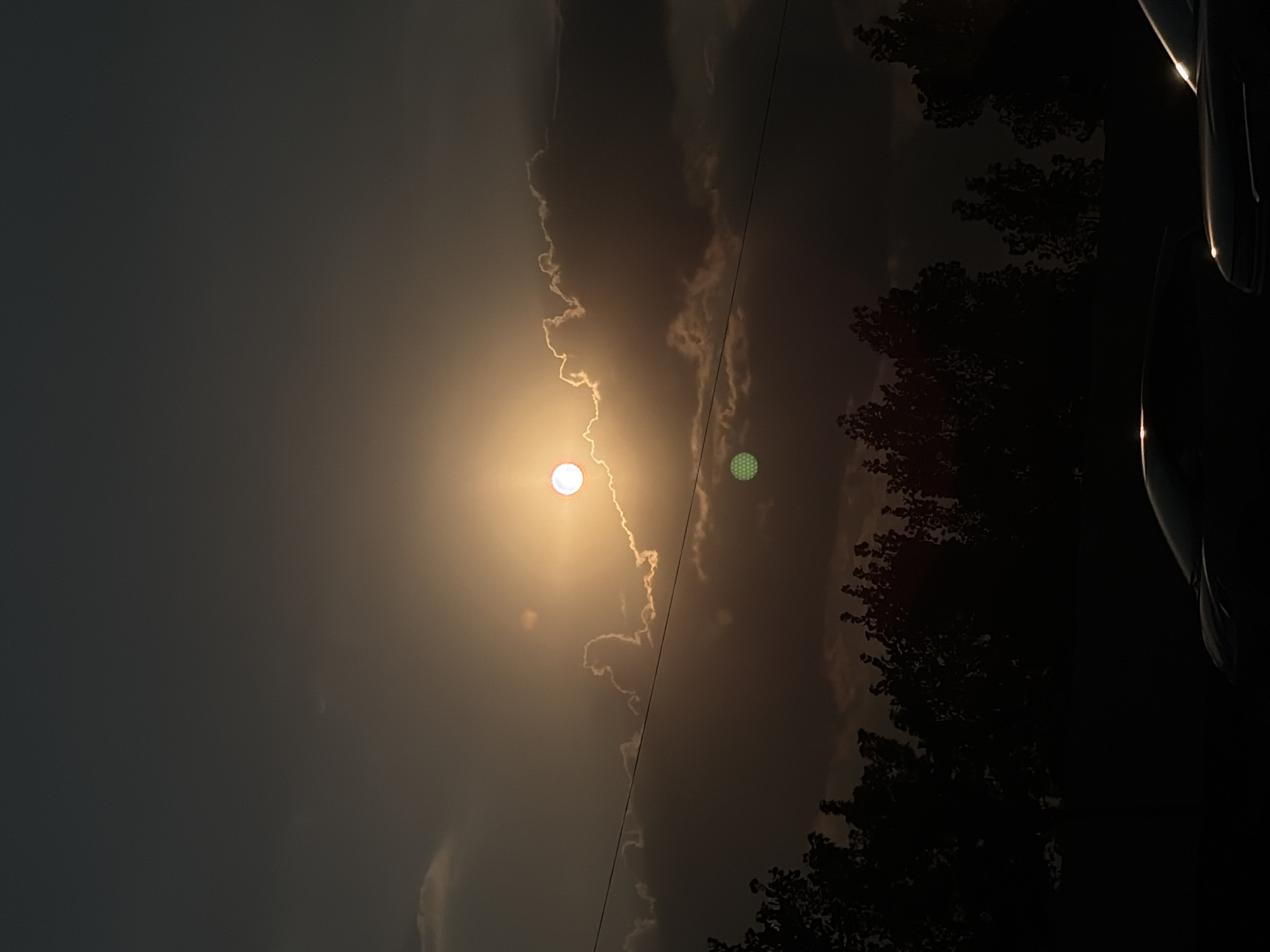 Halo sun at dusk over Tashkent's evening sky