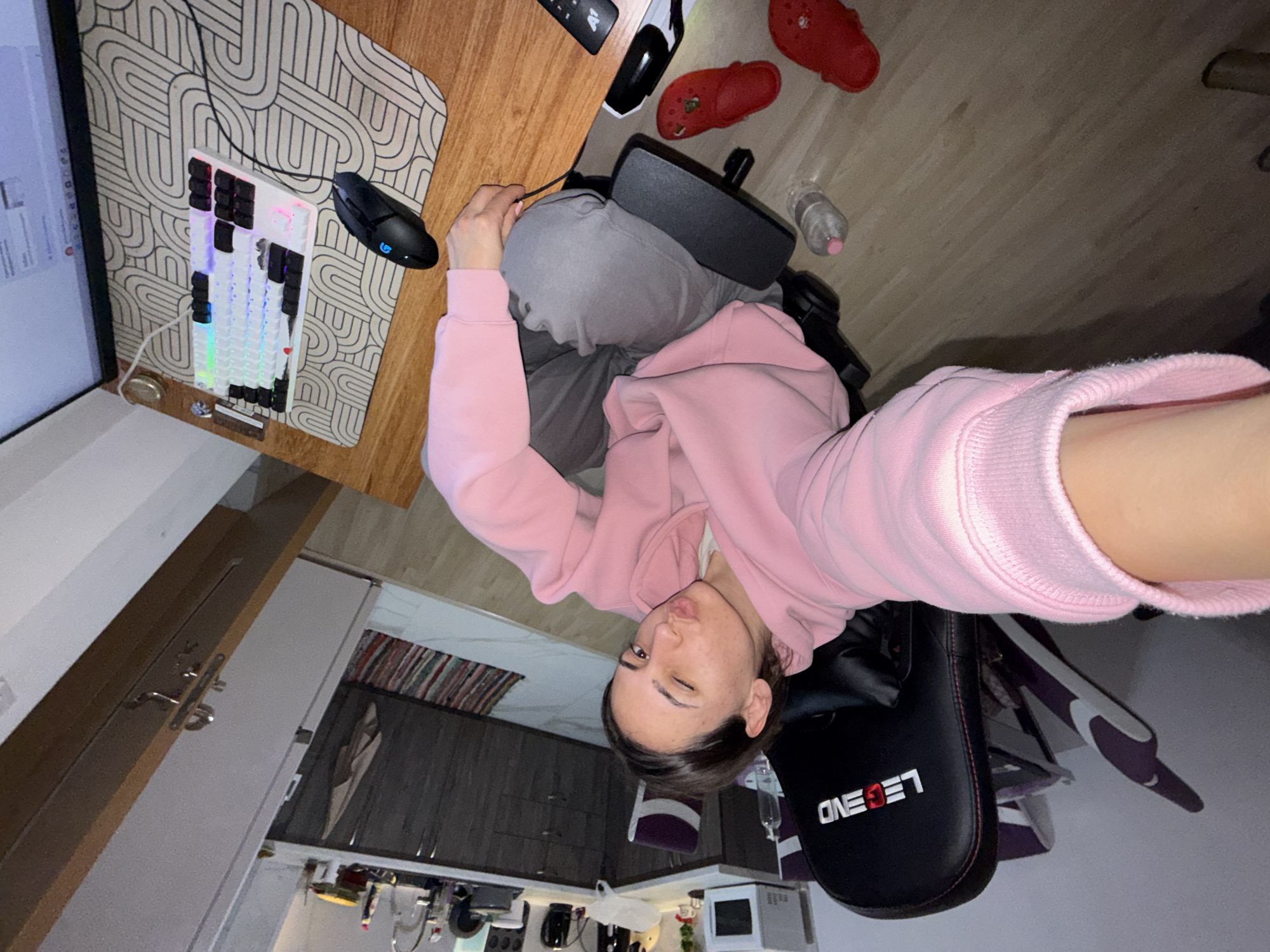 Person takes winking selfie in gaming chair, Plovdiv kitchen