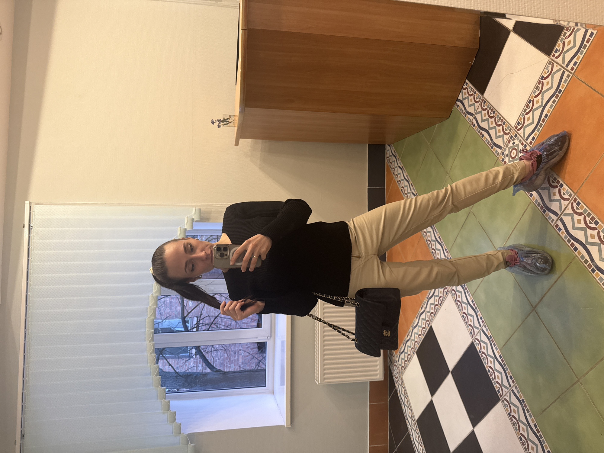Woman takes mirror selfie indoors in Saint Petersburg