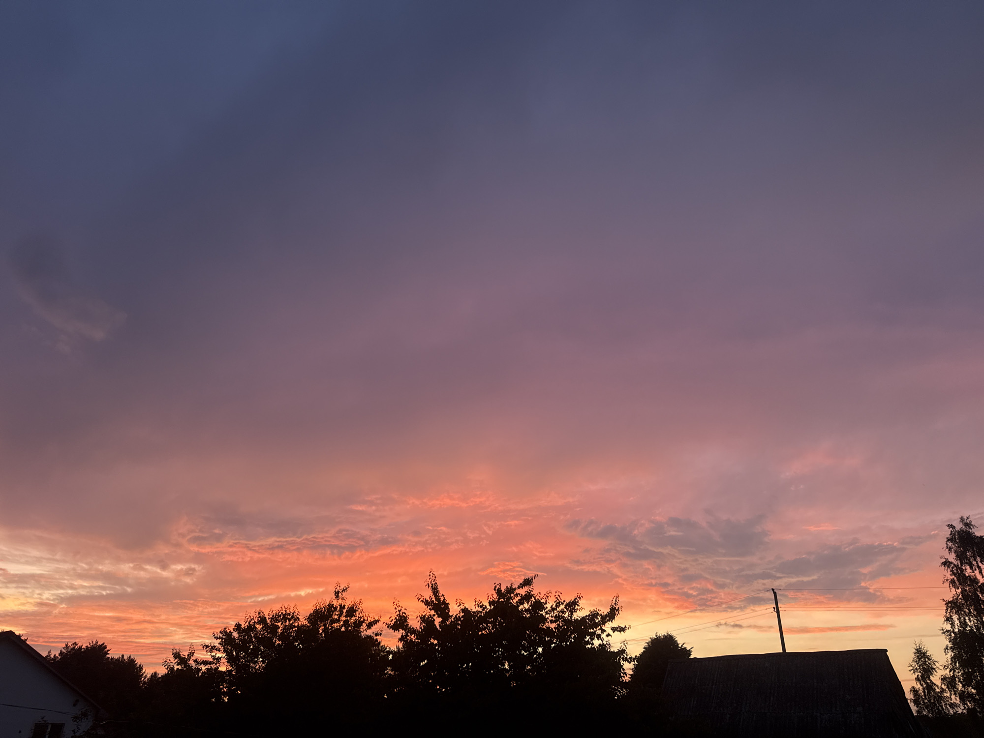 Summer solstice evening at a rural property, inside and out