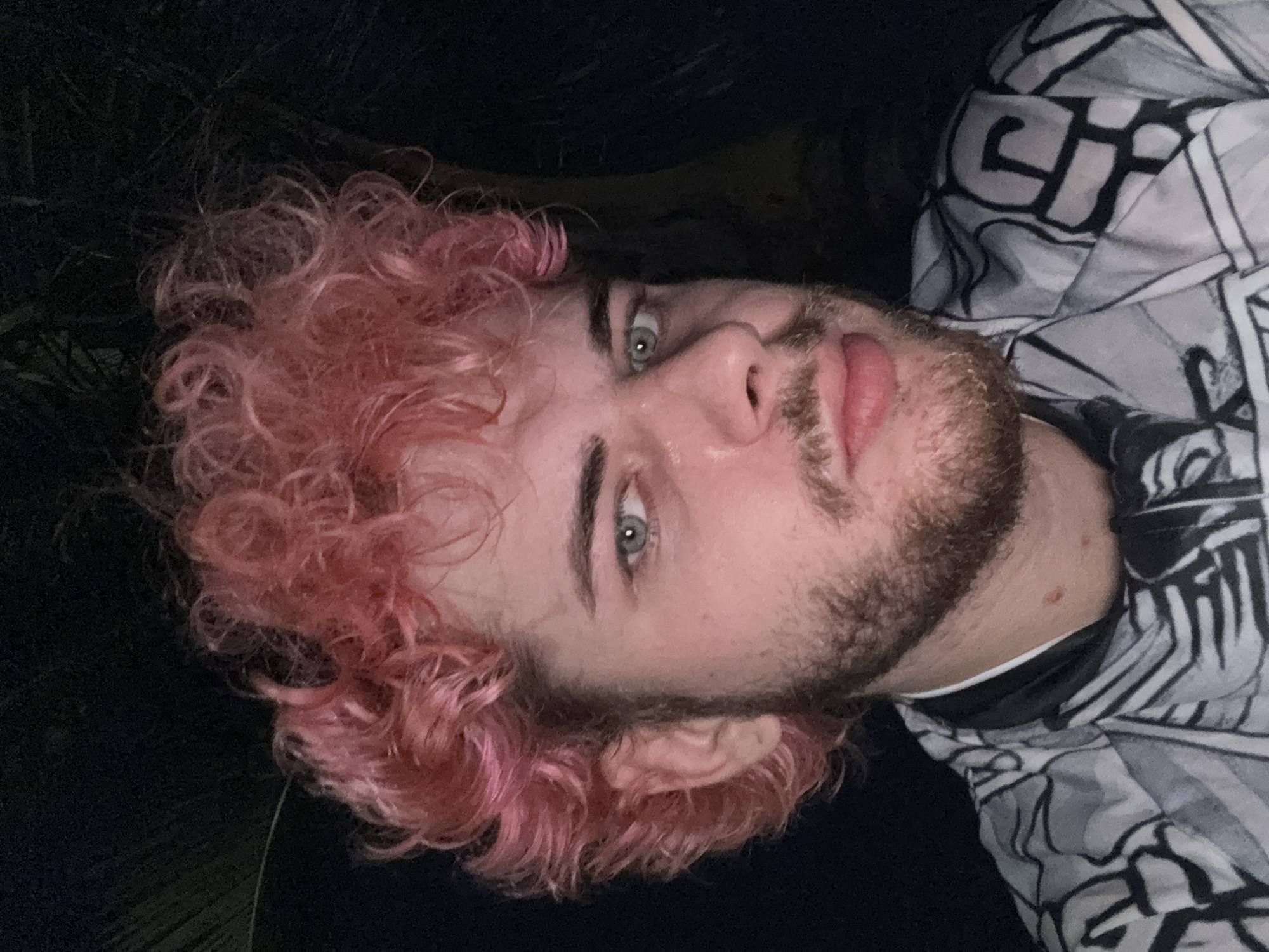 Pink-haired cyclist prepares for night ride along Đà Nẵng coast