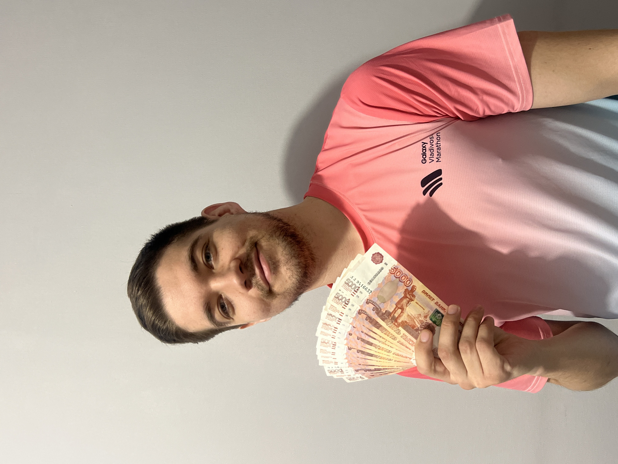 Man displays stack of rubles in Kazan