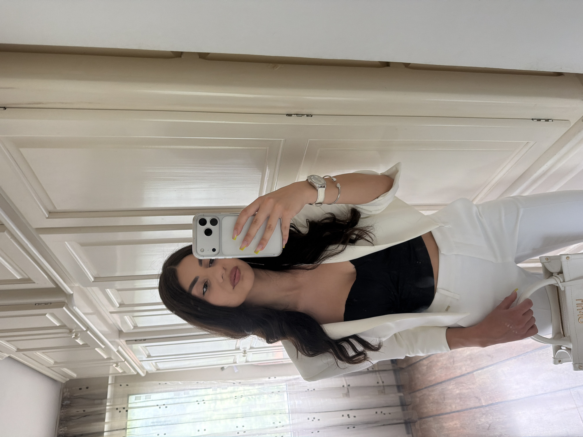 Woman takes mirror selfies in Gabrovo, Bulgaria residence