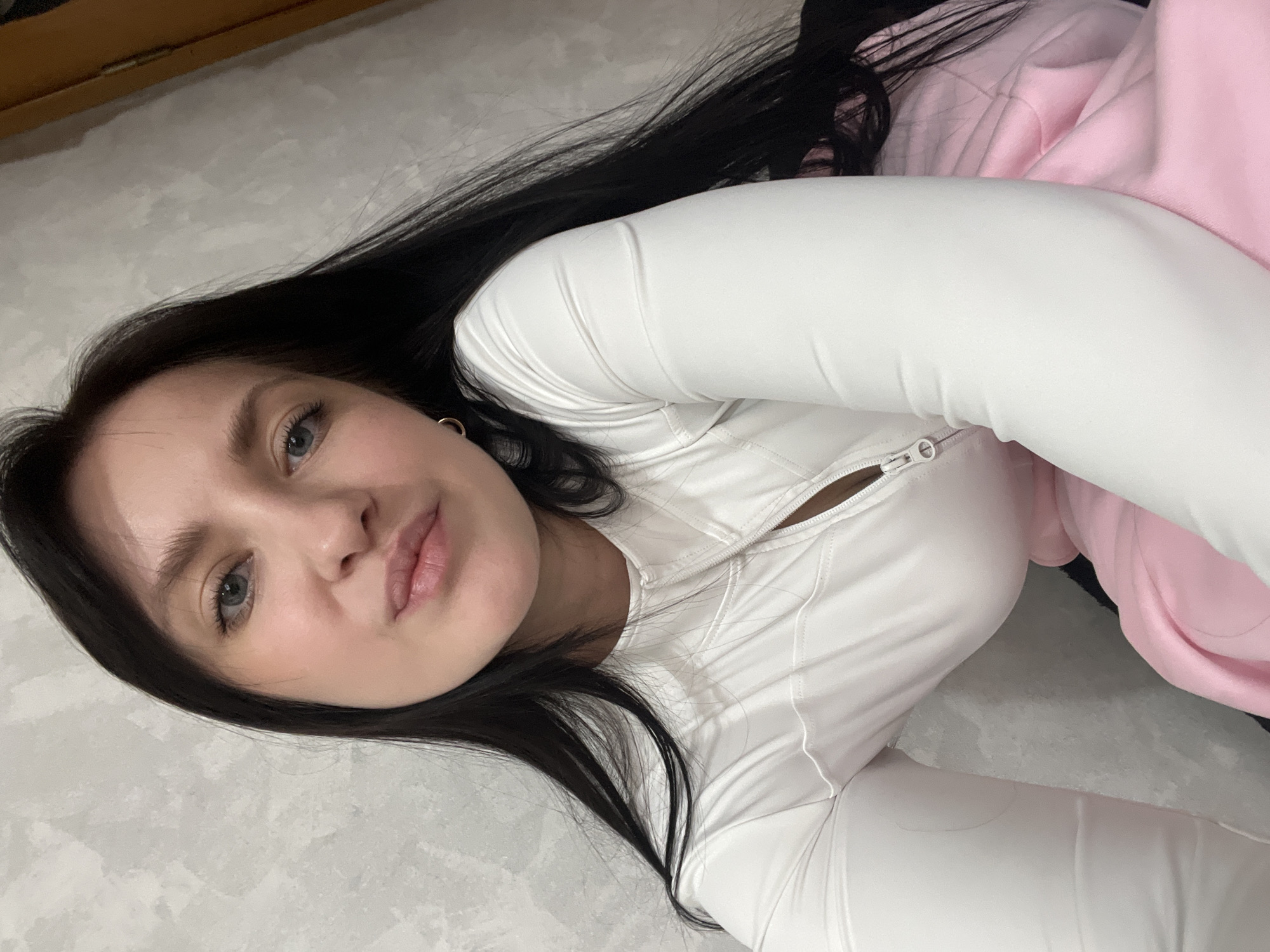 Woman takes morning selfies on bedding in Марковский