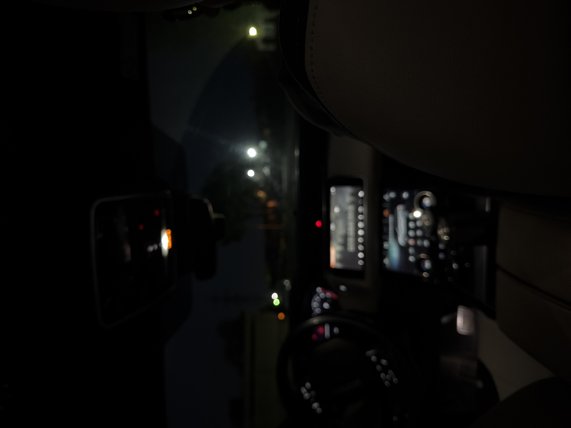 Vehicle interior photographed during nighttime drive in Krasnoyarsk