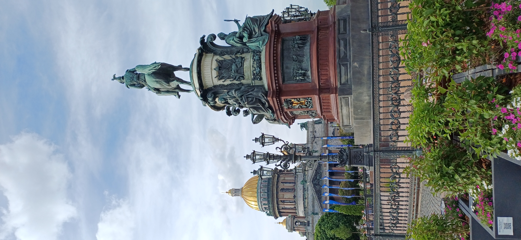 Visitor documents Saint Isaac's Cathedral and summer flower displays