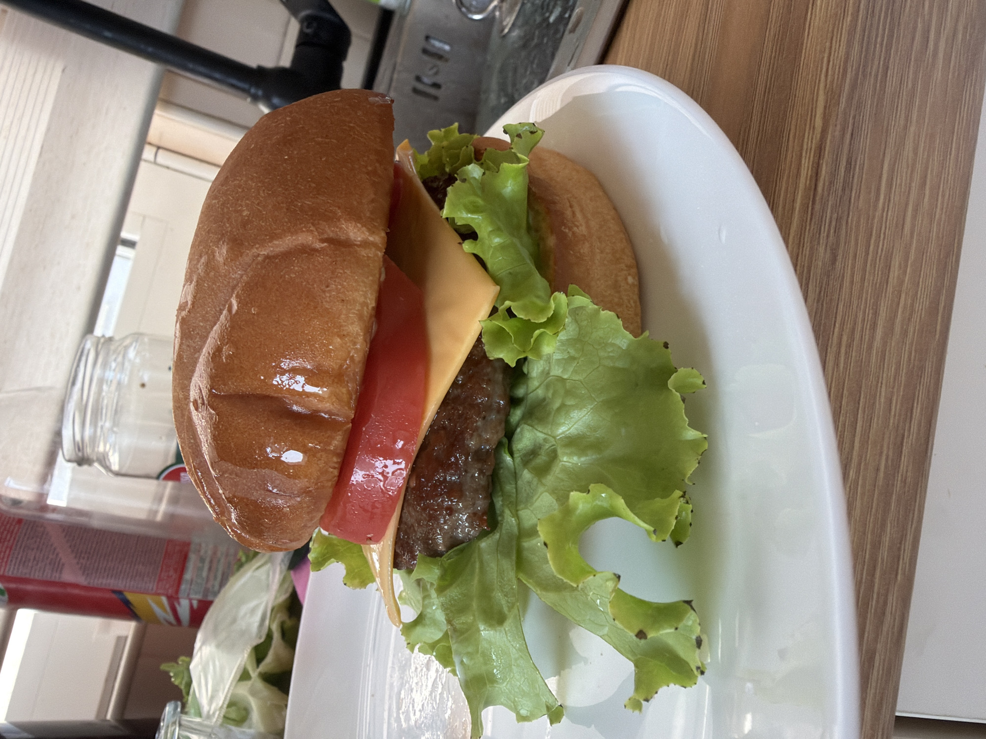 Man poses with burgers in Montenegro restaurant
