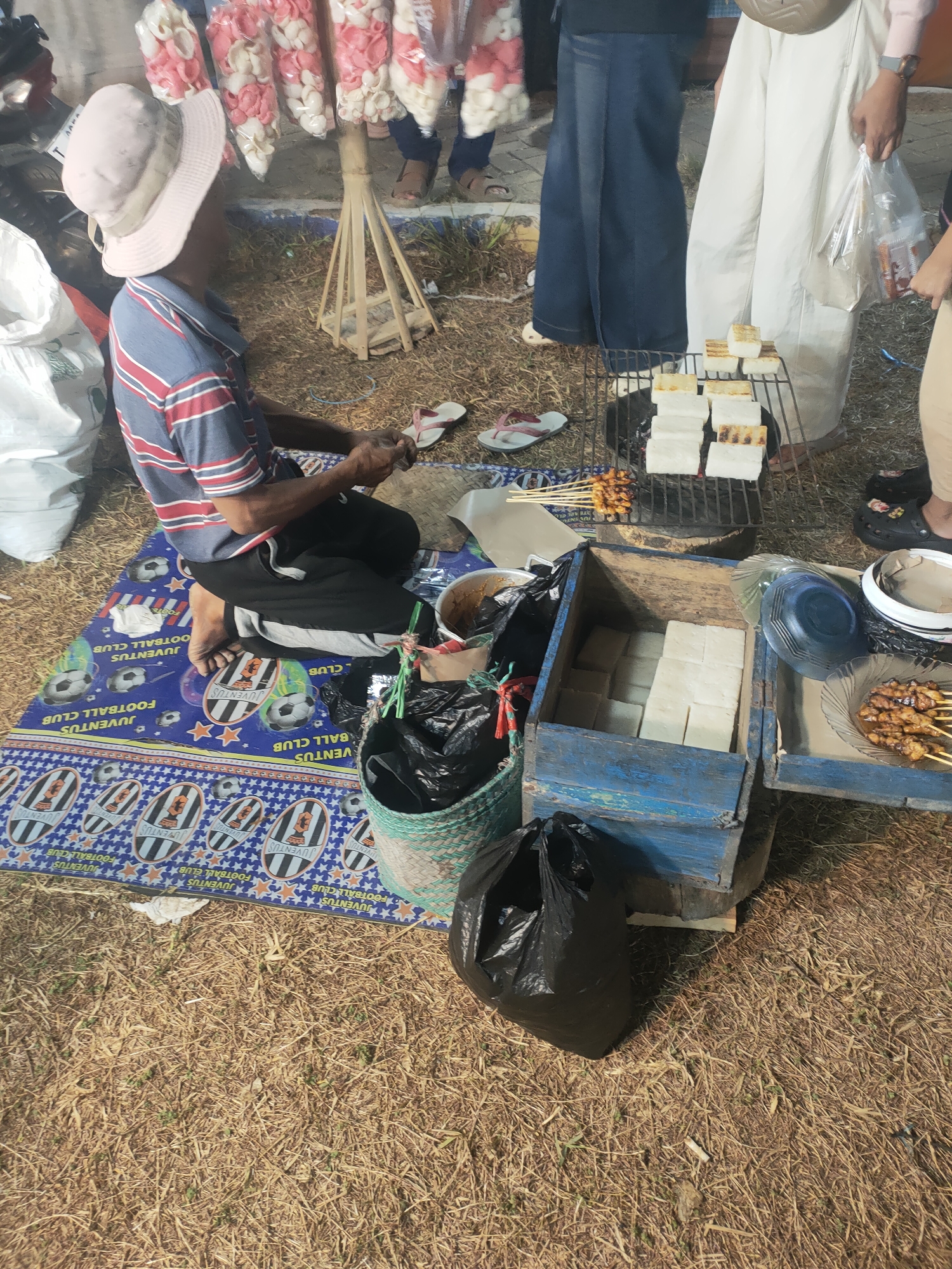 Night market in Subang: fish games, grilled food, kids everywhere.