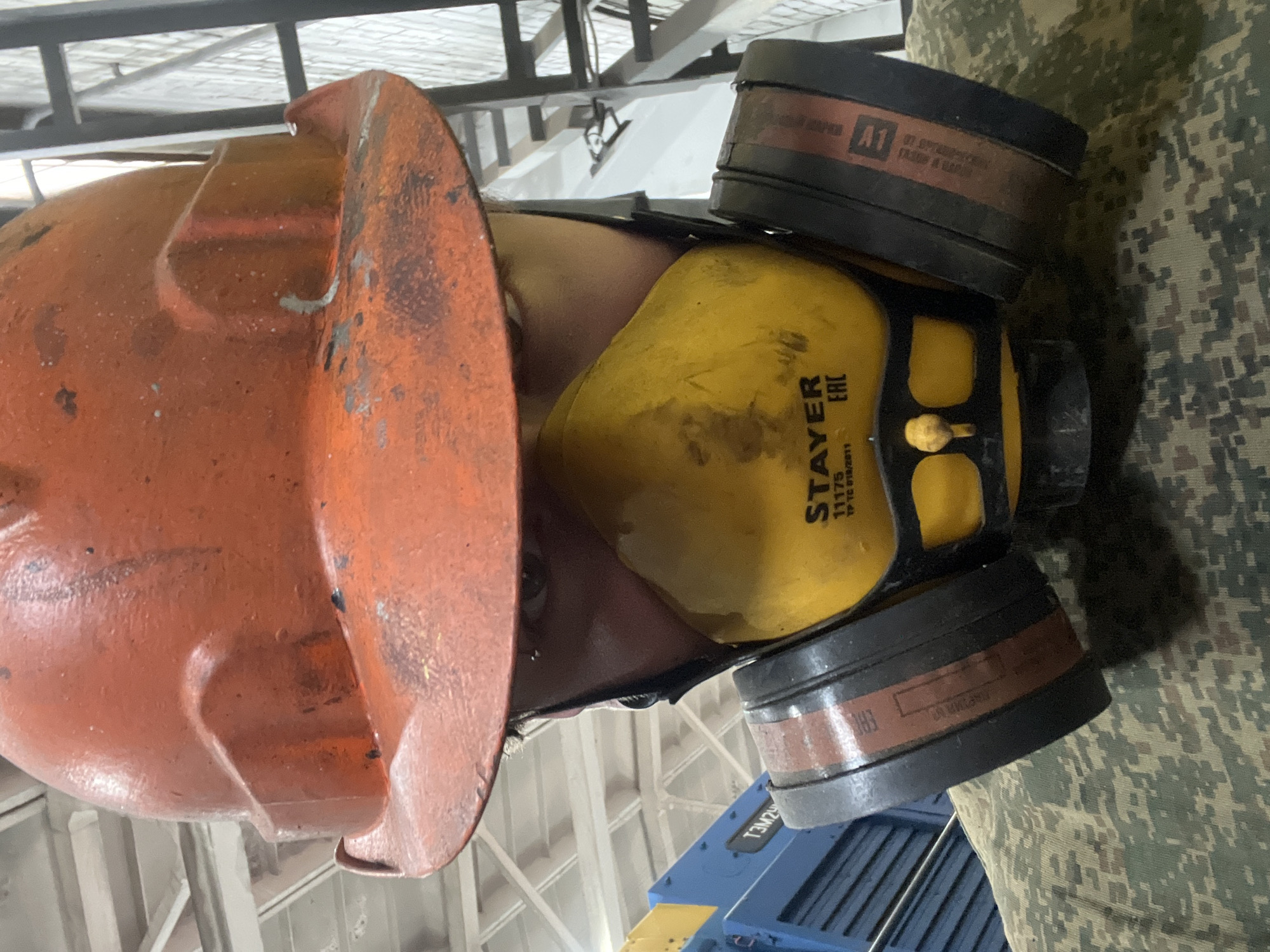 Worker in protective gear observed in Chaikovsky workplace