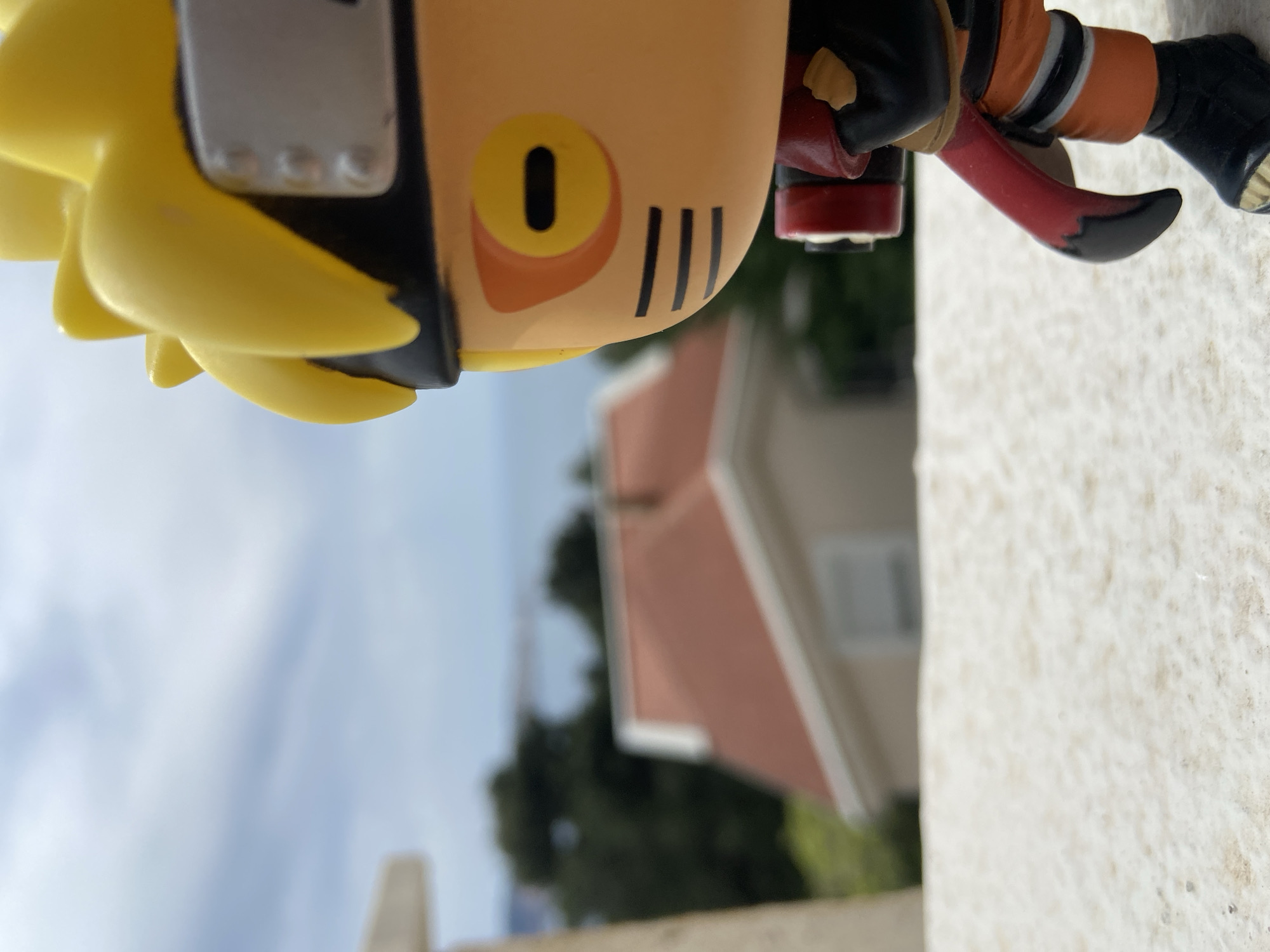 Anime figurine photographed on Montenegro balcony overlooking Adriatic Sea