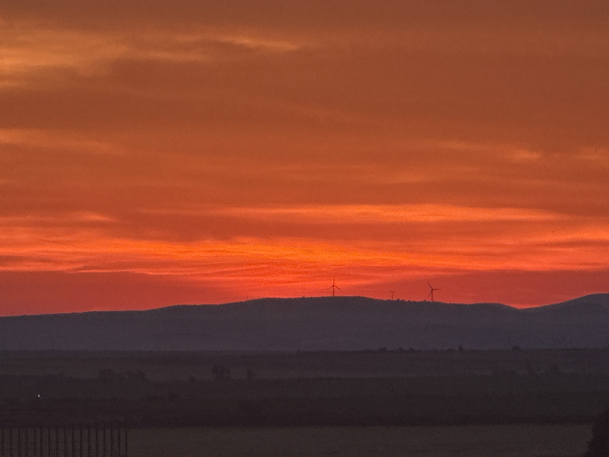 Dramatic sunset illuminates Burgas, Bulgaria industrial landscape